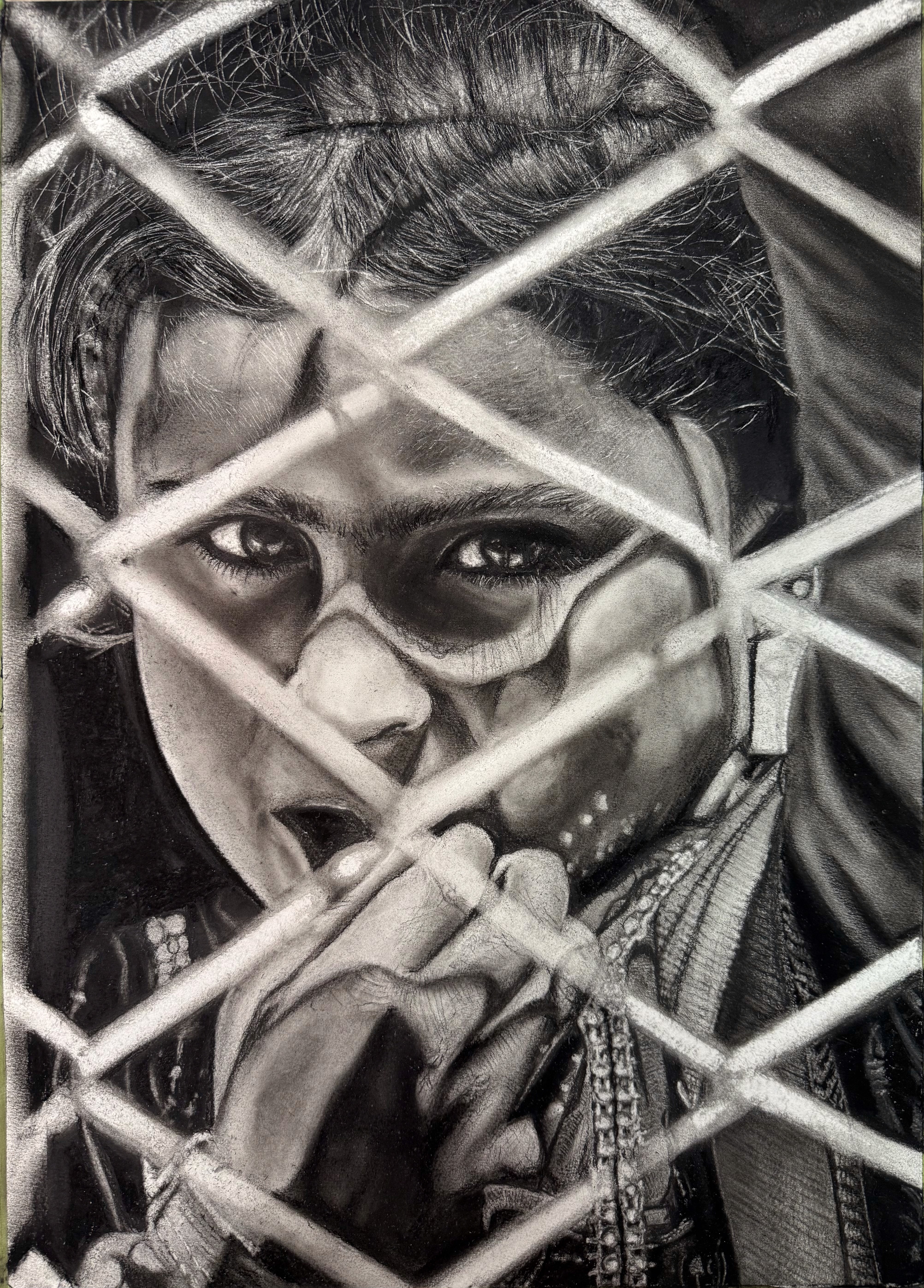 Black and white portrait of a woman viewed through a geometric metal grille