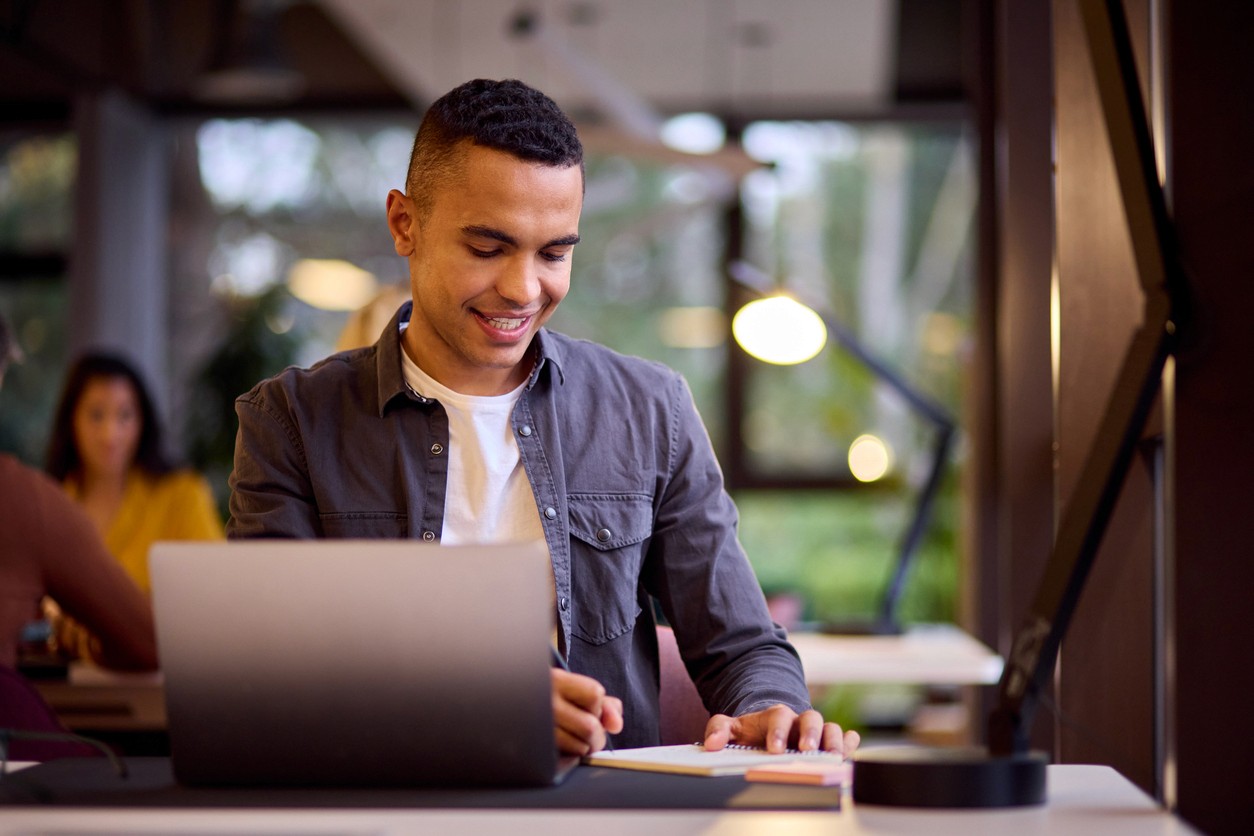 man in a bright, green office