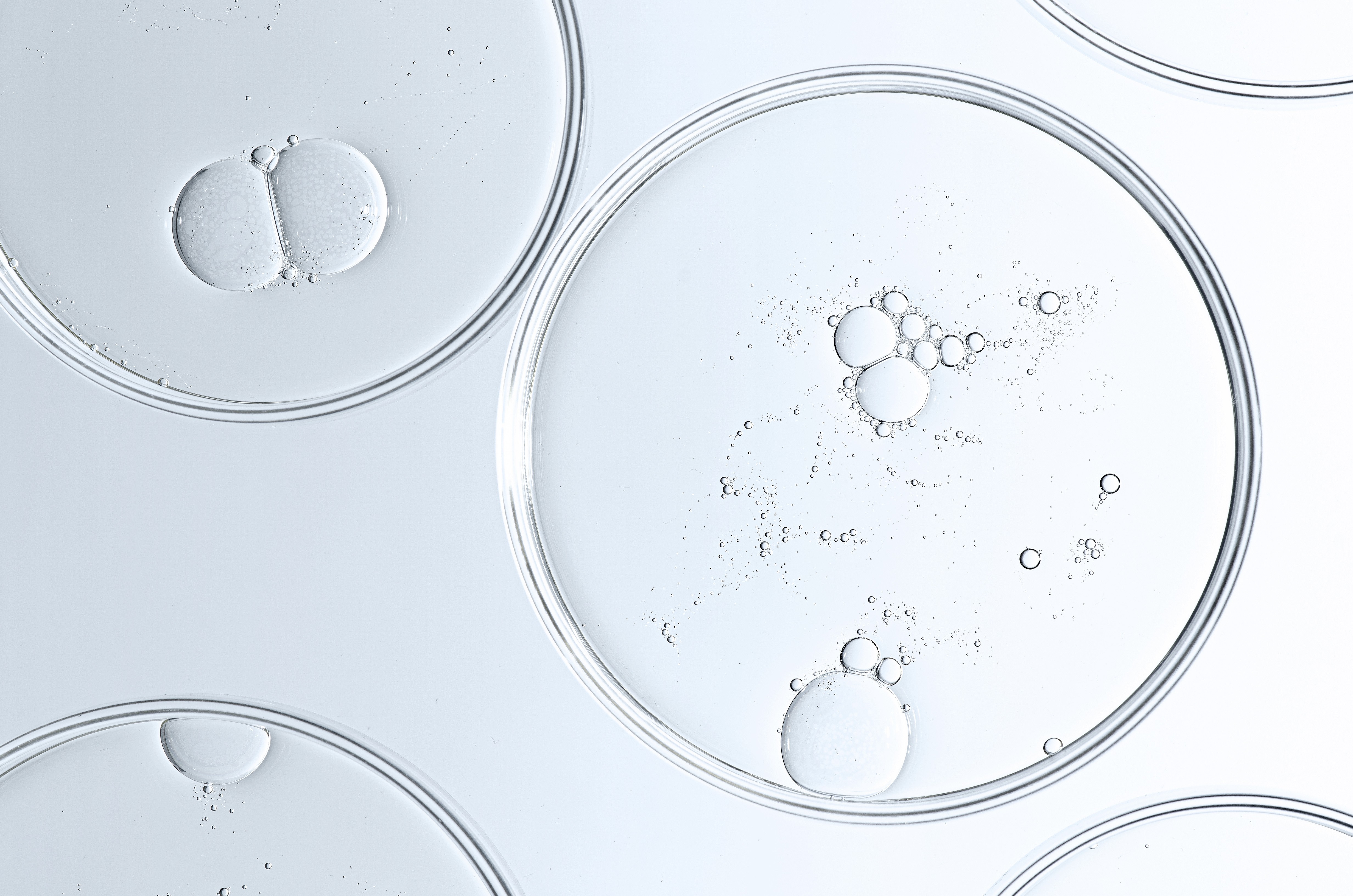 The texture of a cosmetic serum - droplets with bubbles.