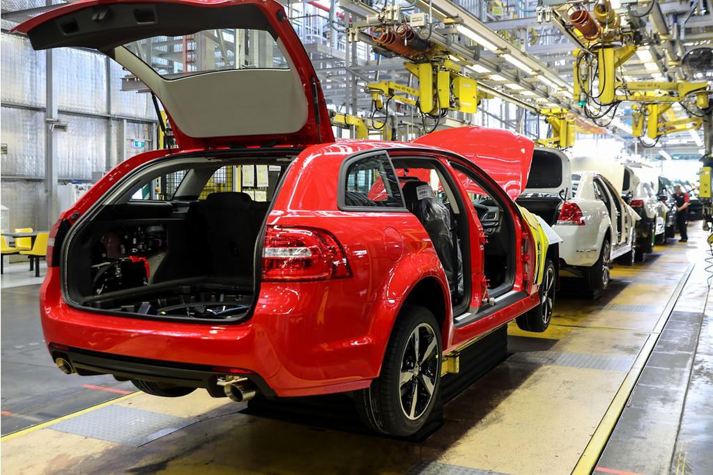 Electronic products (monitor, laptop, tablet, phone) on a table.