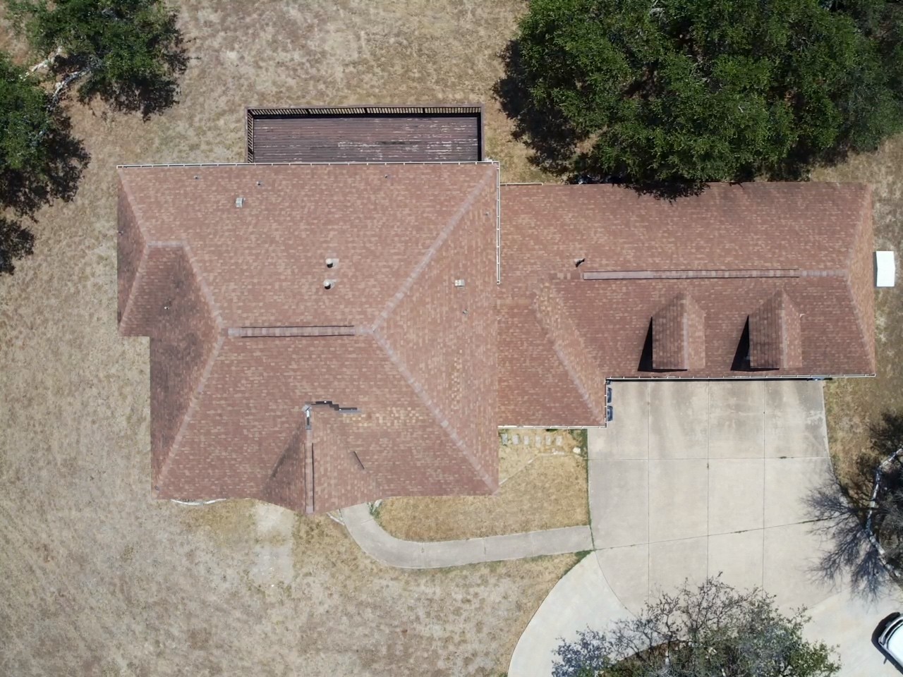 Old Hip roof with storm damage.
