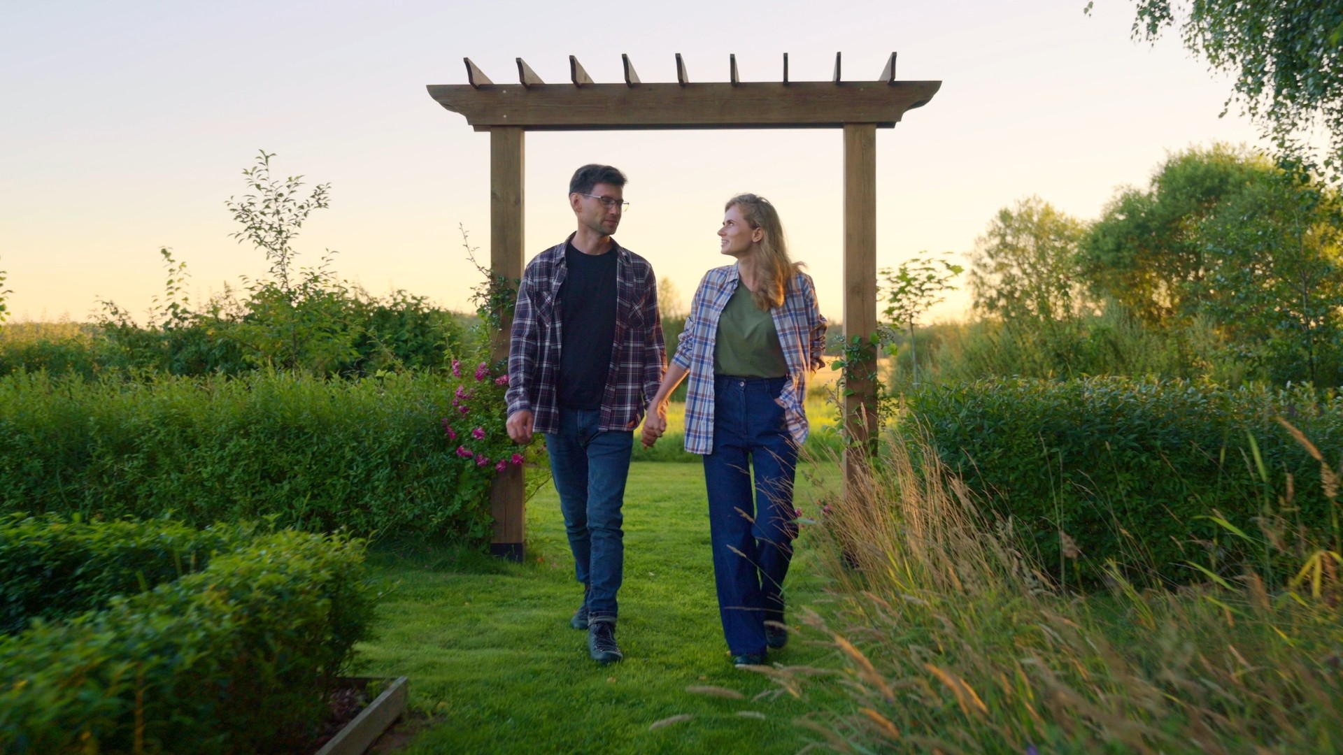Garden owners at sunset in the garden