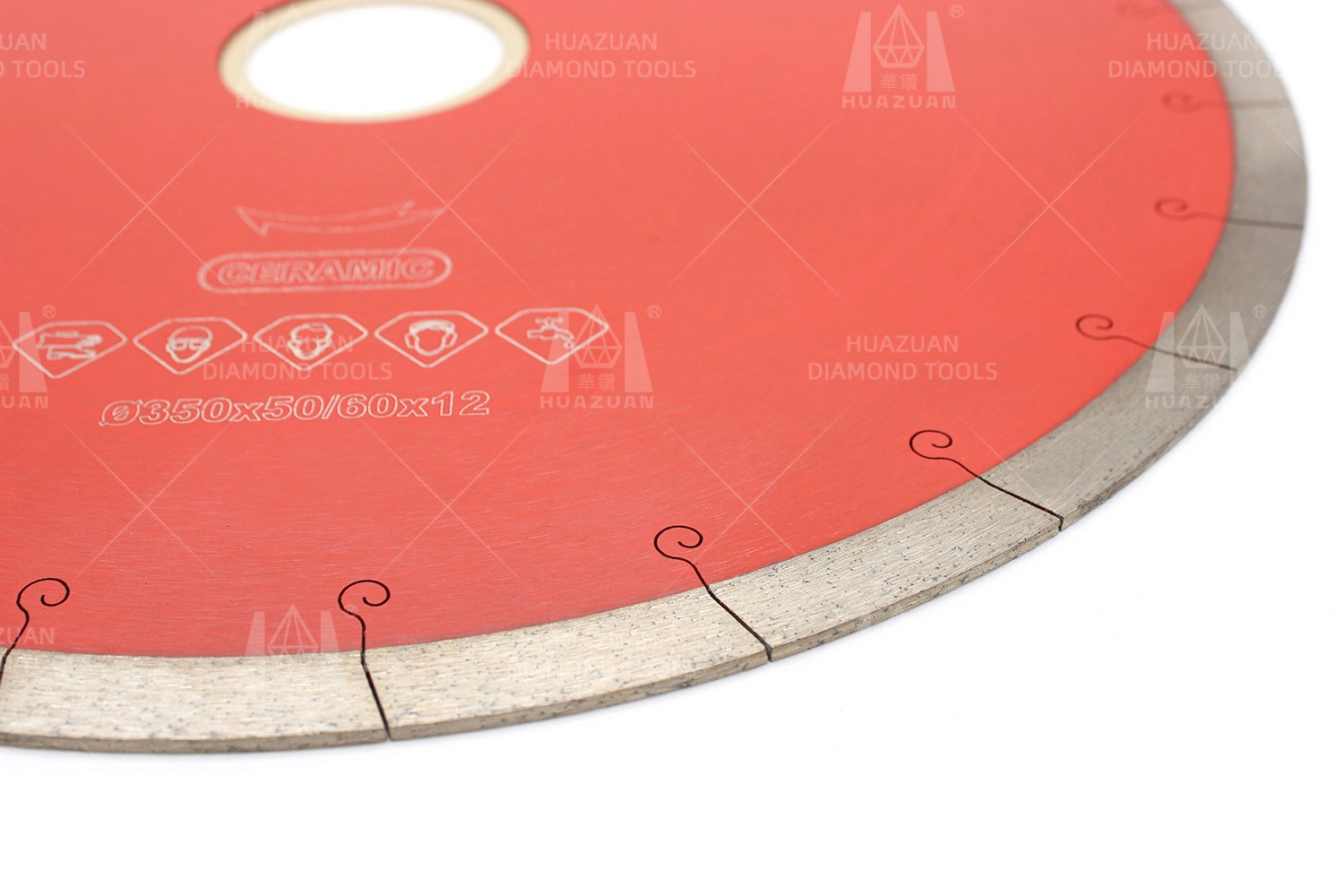 Partial view of a red sintered diamond saw blade for ceramic, highlighting the narrow slot design for minimized chipping.