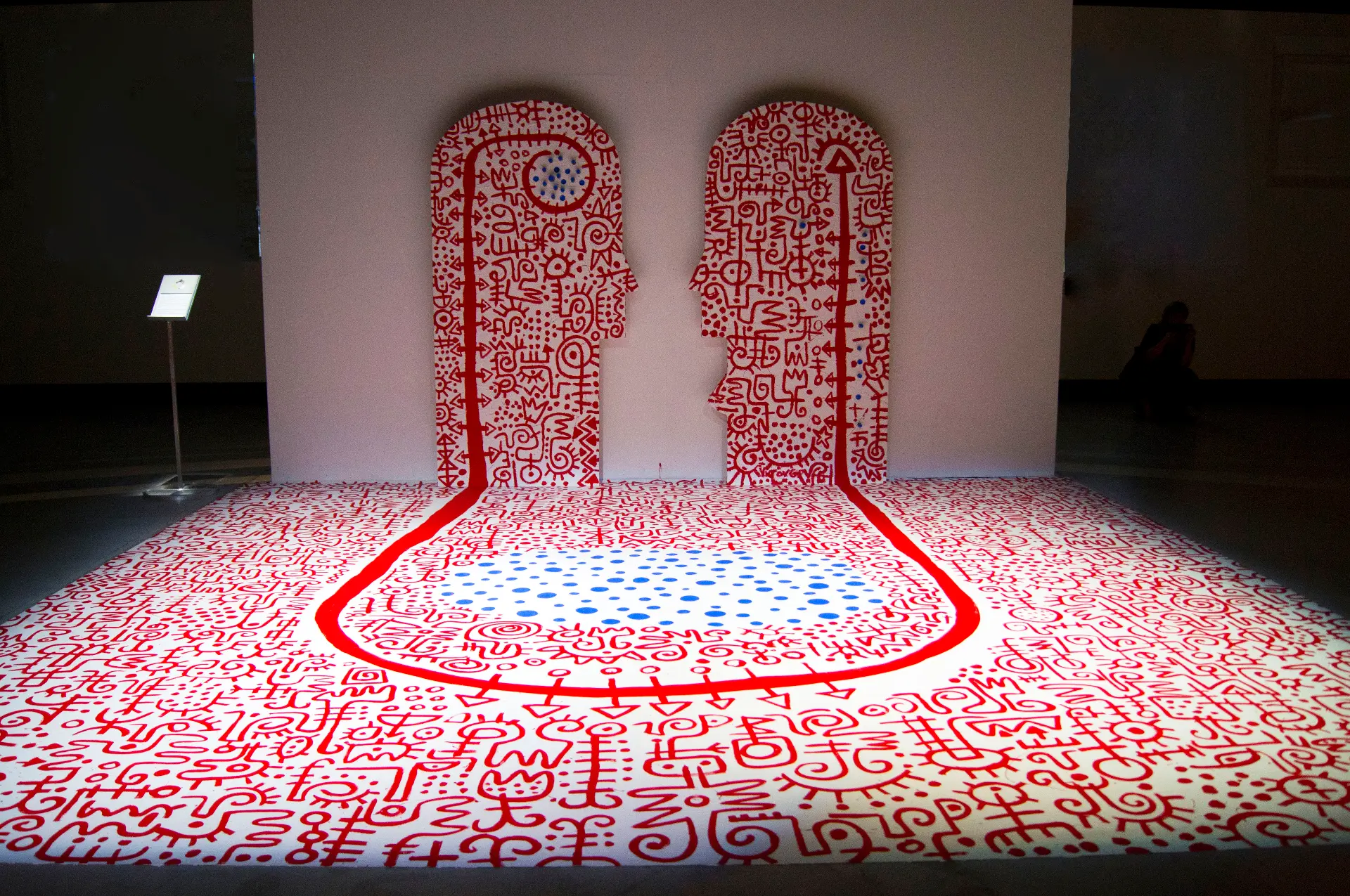 State of Beings (2013). Installation, 86 in. × 200 in. (floor), 178 in. × 41.58 in. (wall). Acrylic, vinyl and metal on wood panel and vinyl mat. Created in Apt, France, during a sculpture workshop to mark the tenth anniversary of Fondation Blachère. Image Cedit: Mabeye Deme and Victor Ekpuk