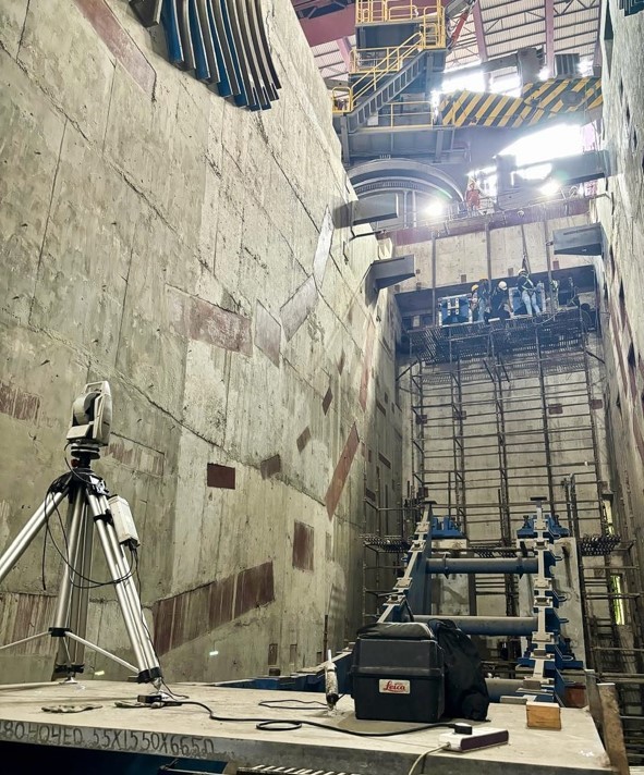 Framed view of rolling mountains and evergreen trees.