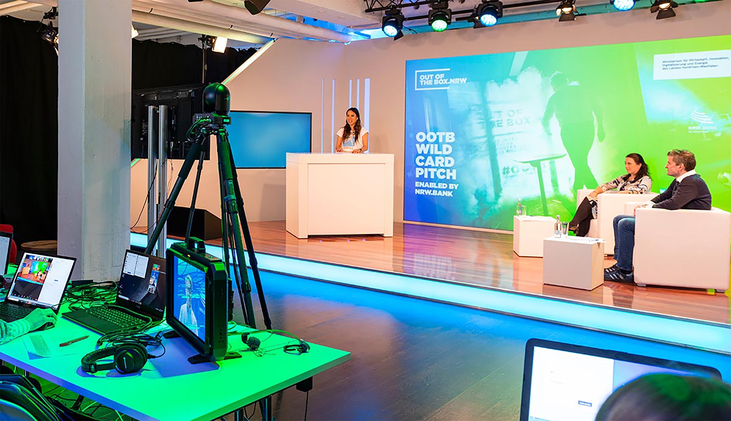 Young black woman witting at the table working on a laptop