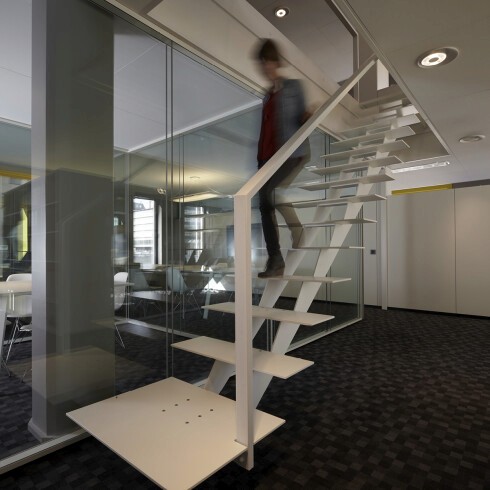 Interior of a cafe or workspace with several people at tables