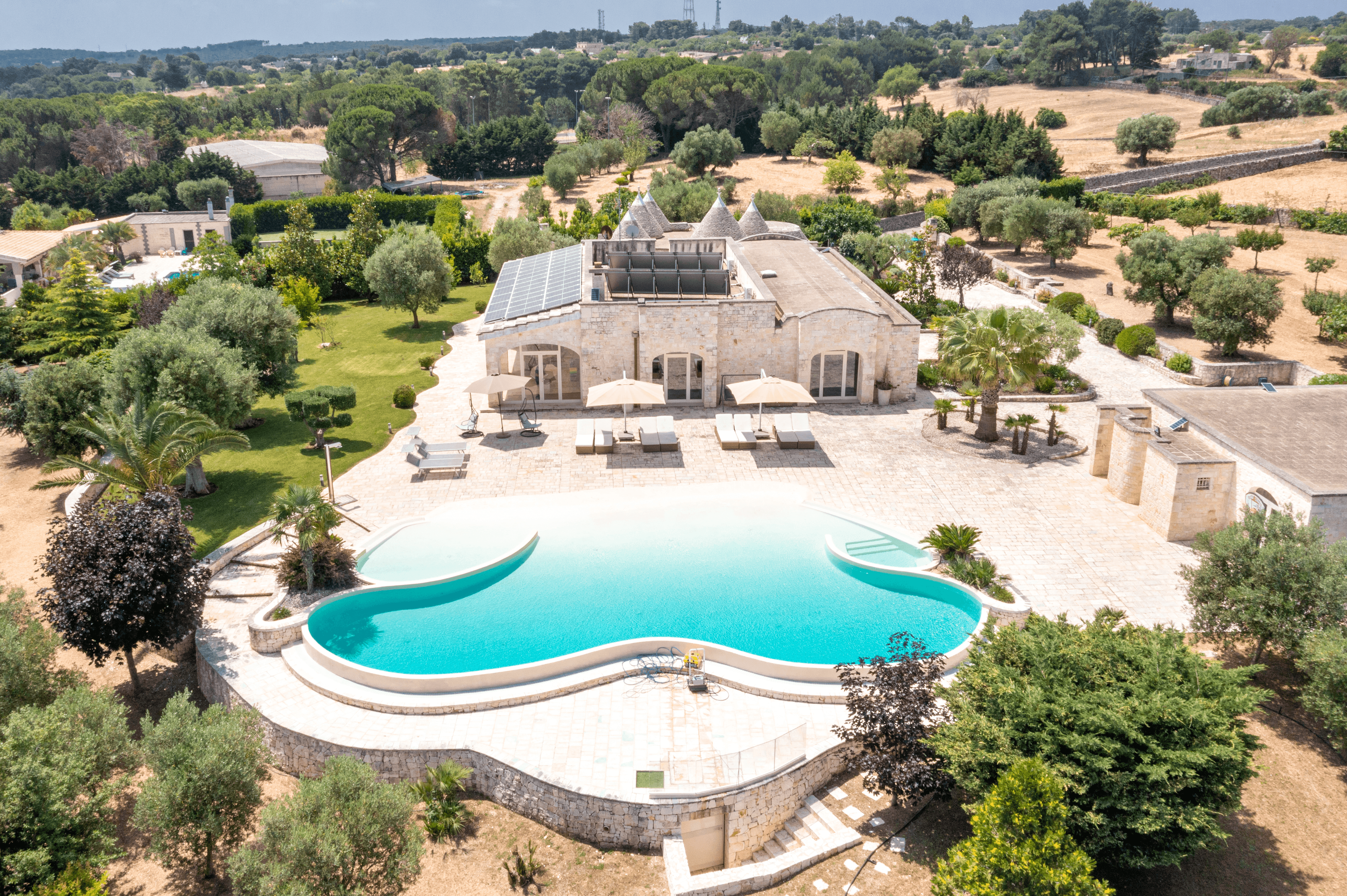Wooden bench overlooking forested hills and a lake