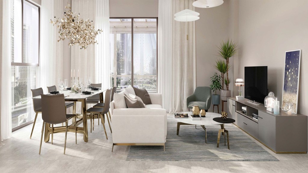 Stylish living room with large windows and a generous table, representing the aesthetic of Moor by Emaar.