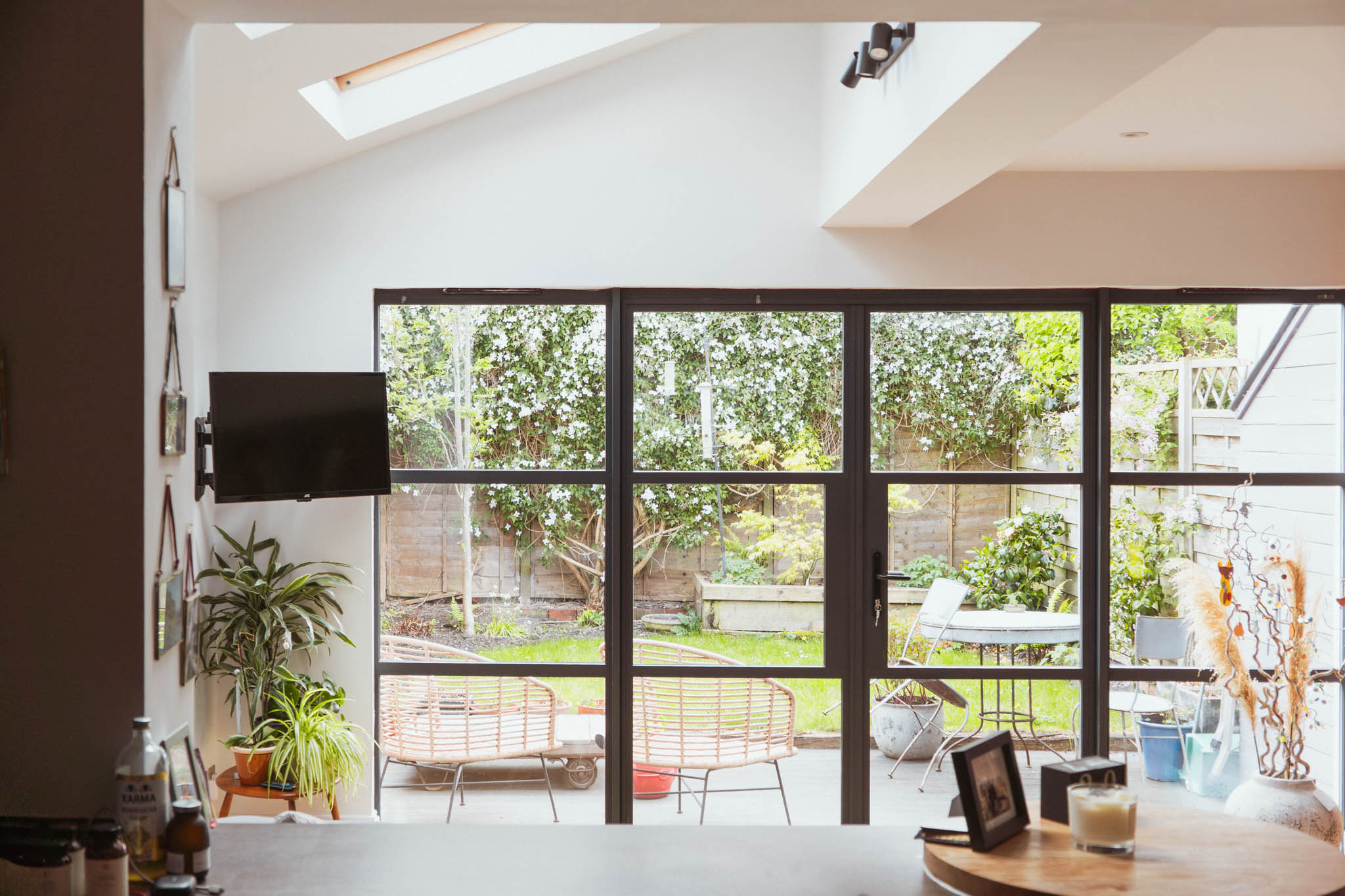 Ground floor side return extension interior with full-width steel-framed glazing and rooflight, Bishopston Bristol — Alec Crisp Architects
