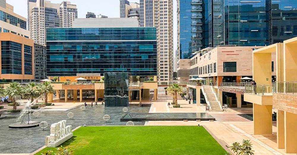 Vibrant Bay Square courtyard view near Ontario Tower, highlighting the active lifestyle of the community.