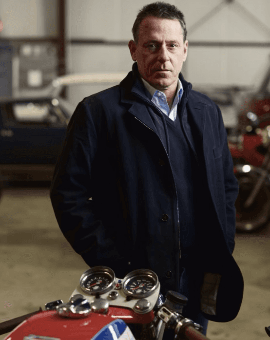man wearing green crew-neck top and eyeglasses with black frames looking at side