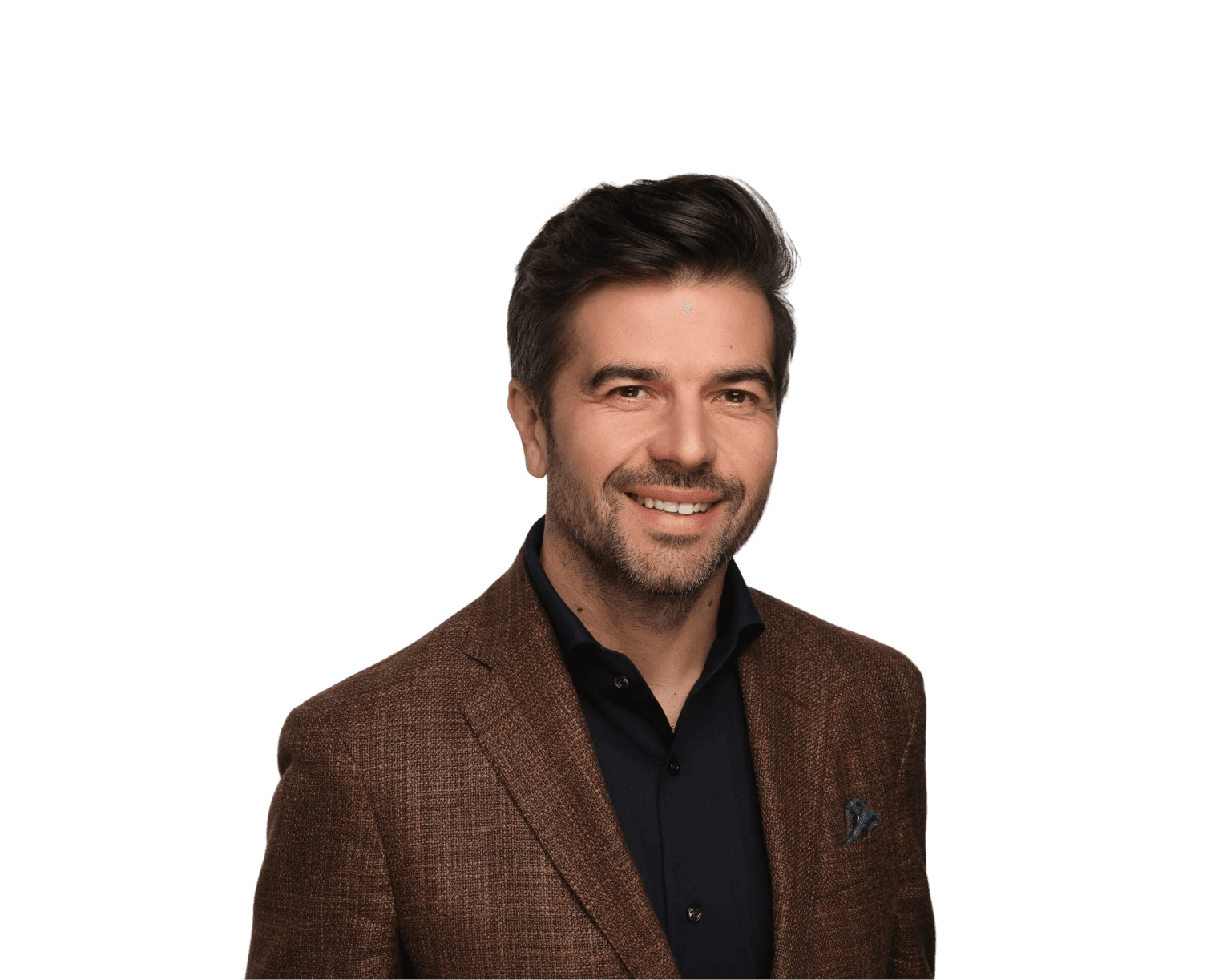 Romain Picard, Senior Vice President Sales, smiling with a brown blazer and blue shirt.