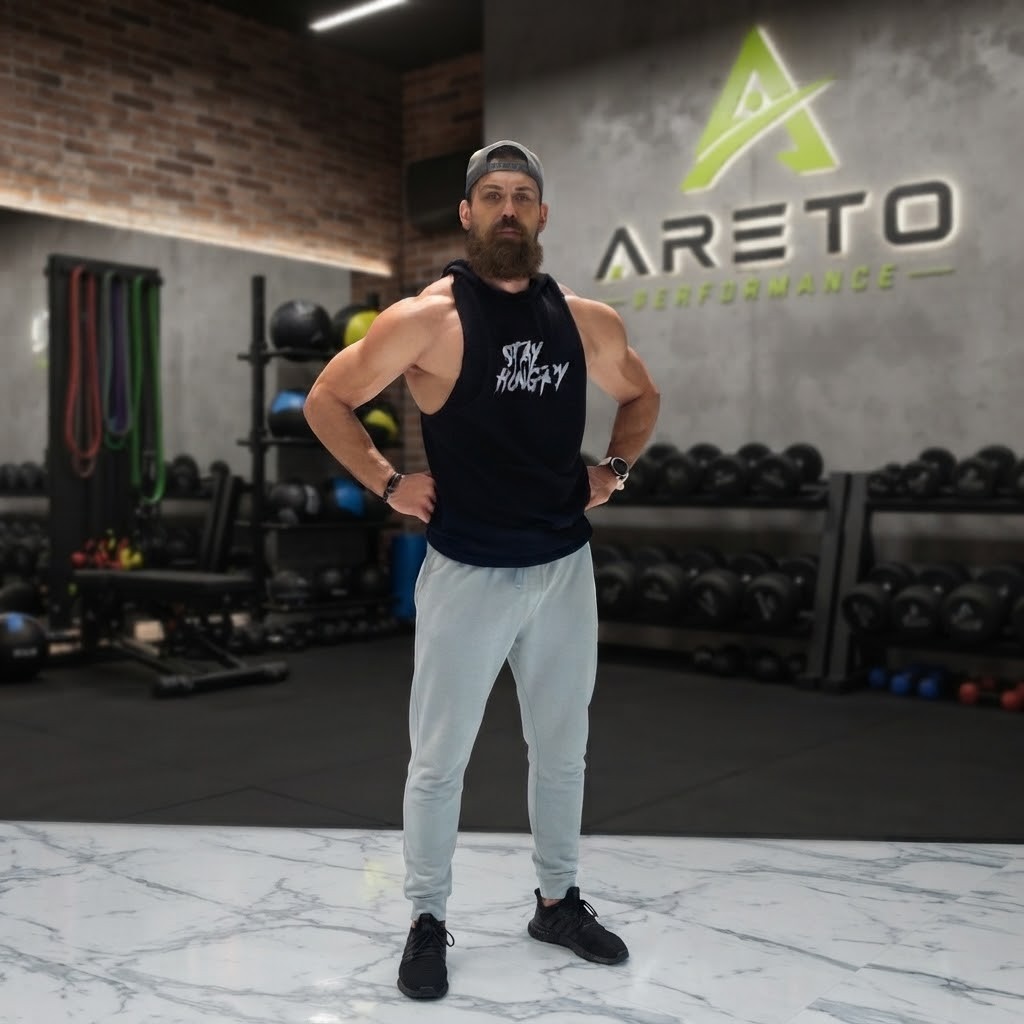 Athlete training in a dark gym