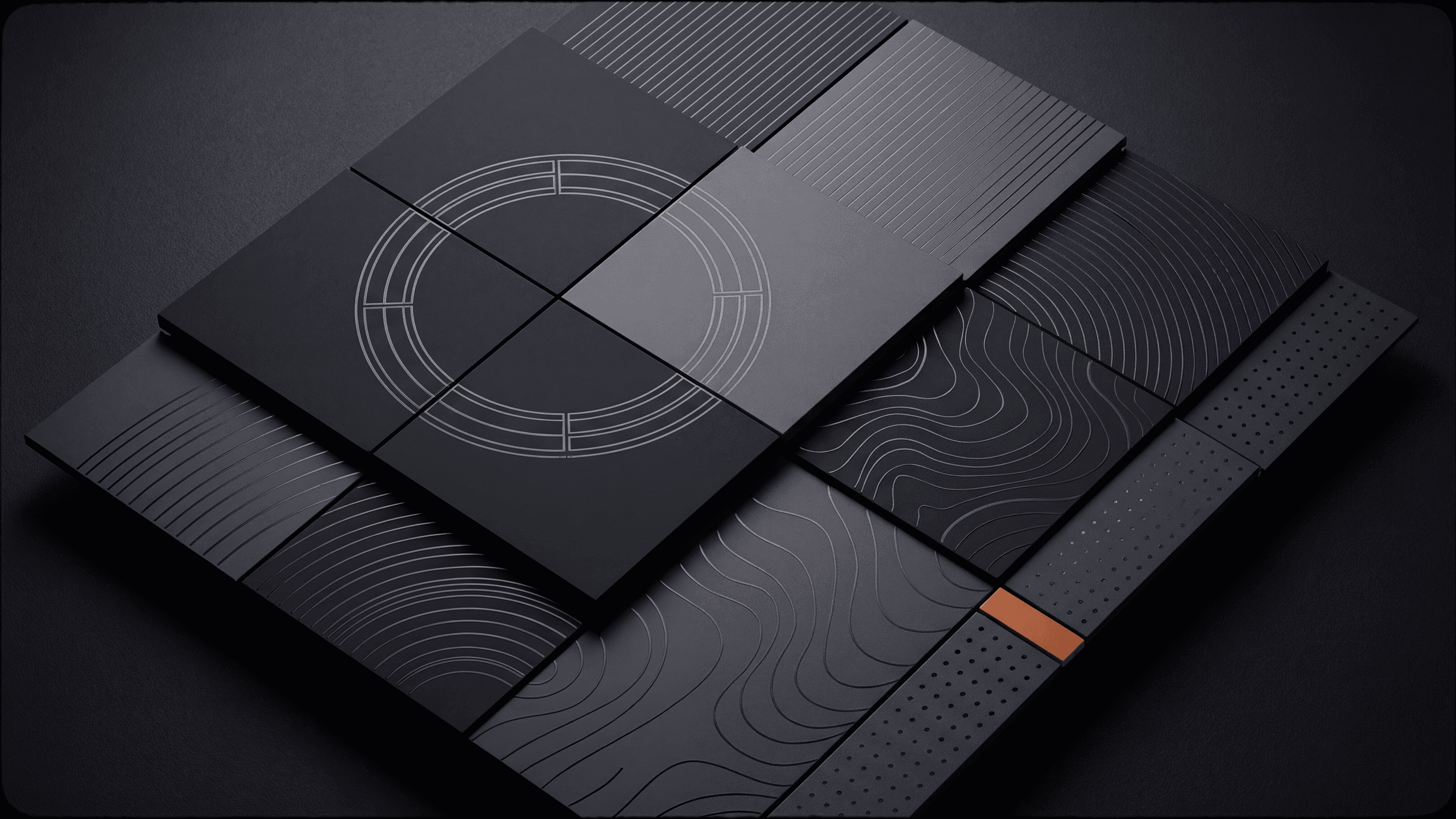 Overlapping black panels with geometric patterns and an orange detail.