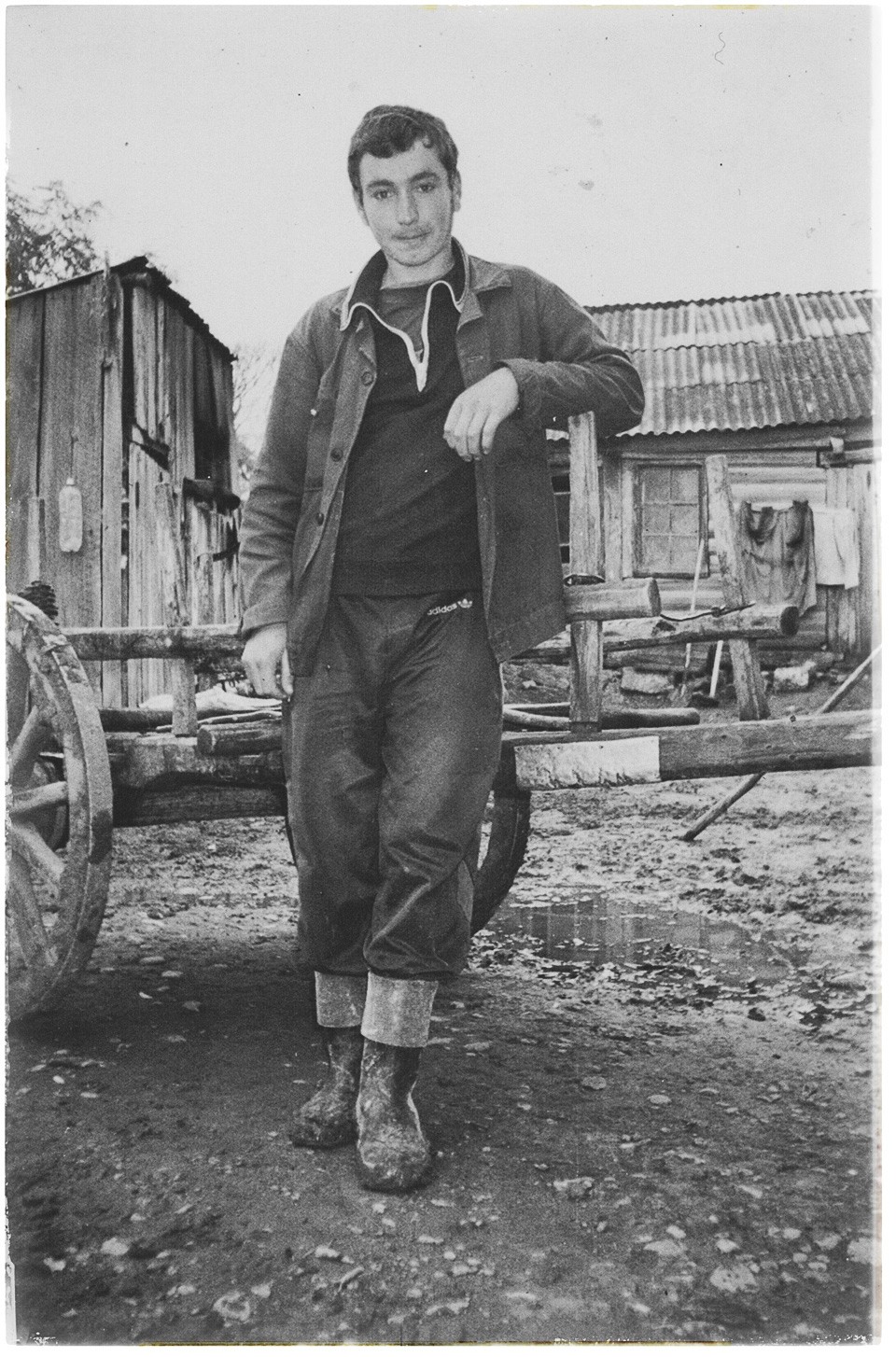 An old photograph of a young Shota near his home.