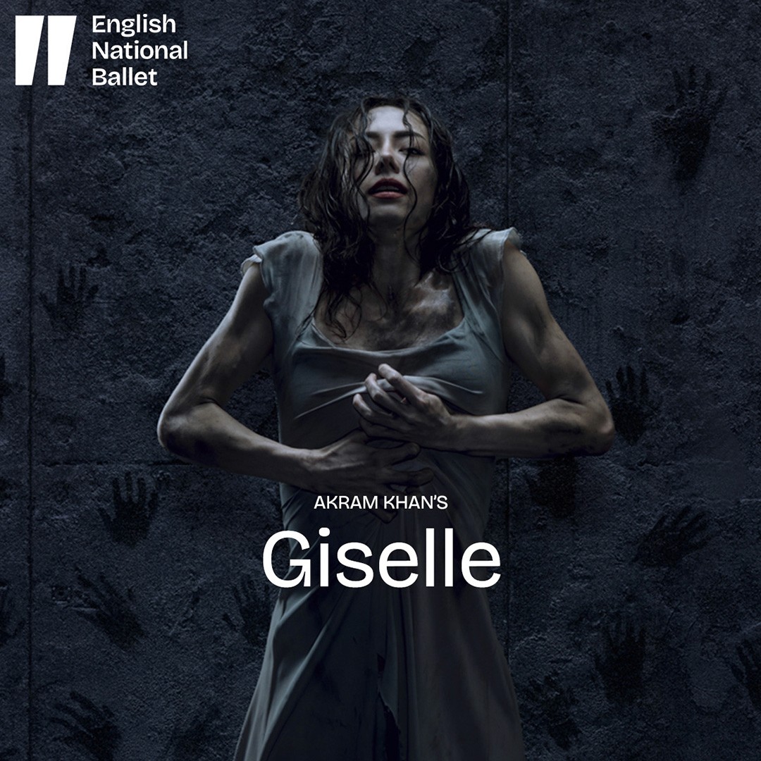 Dancers in Akram Khan's Giselle performing on stage in dim lighting.