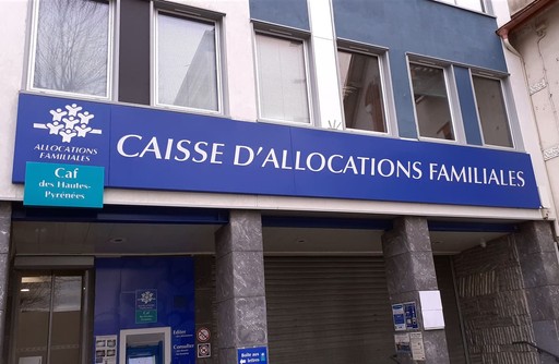 Caisse d'allocations familiales (CAF) front sign on a building
