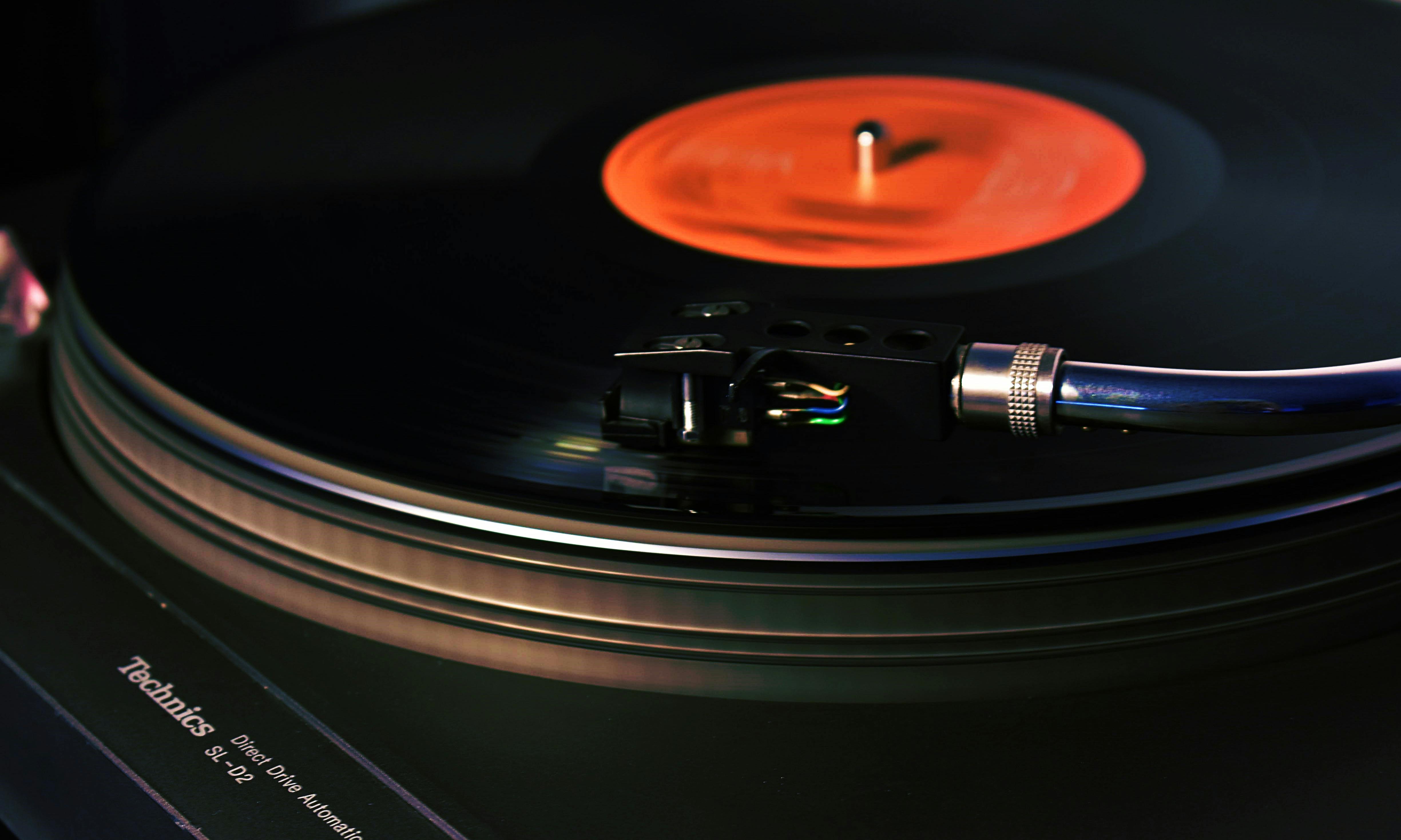 Vinyl record spinning on turntable close up