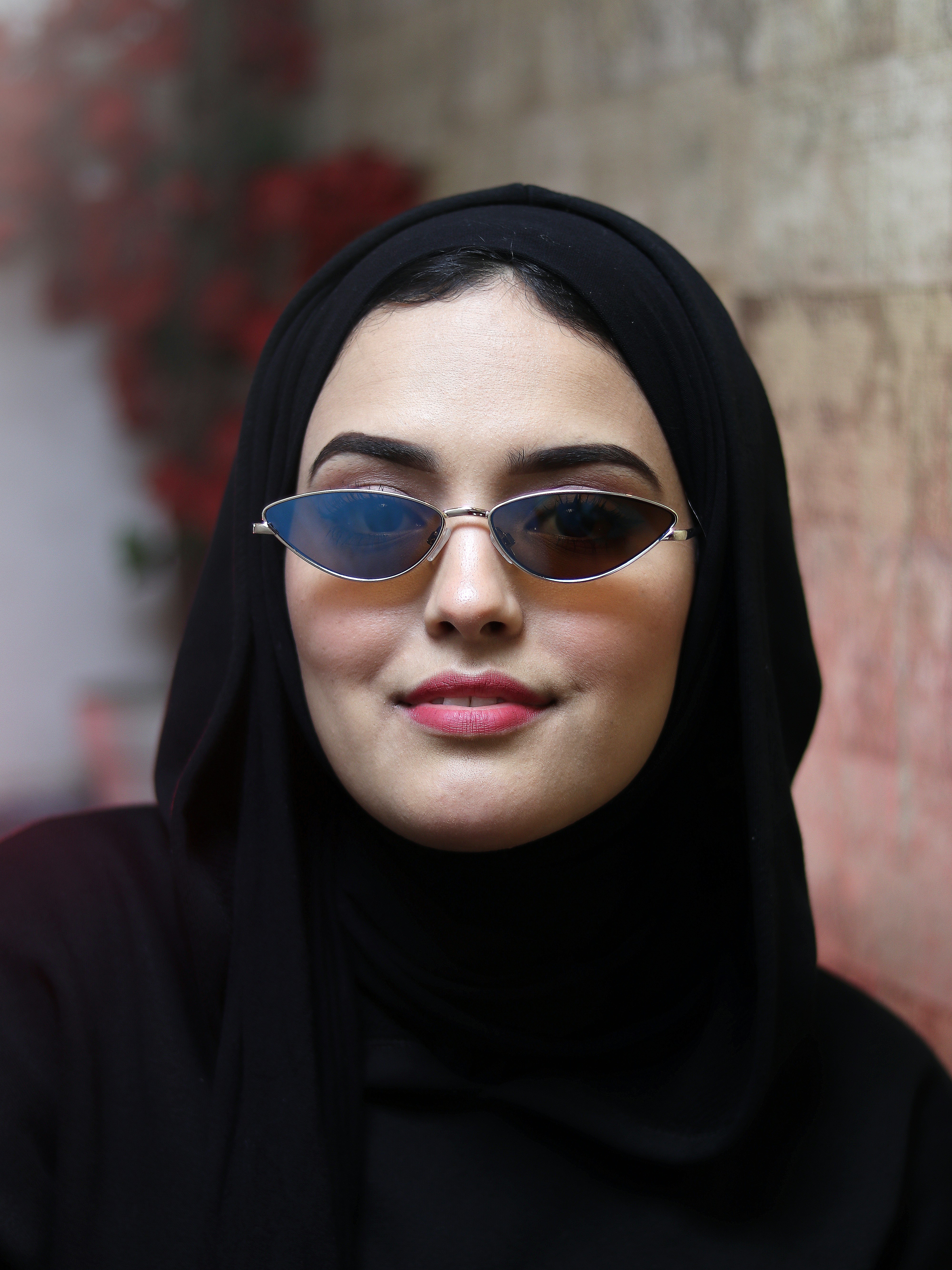 a person wearing a black head scarf