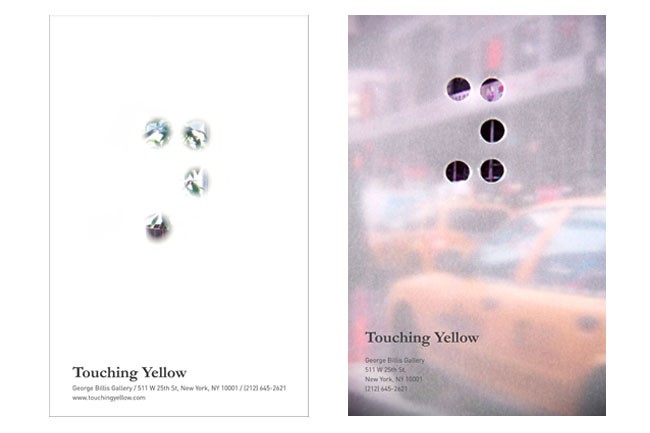 Two business cards are shown side by side. The left card displays four translucent, faceted objects on a white background. The right card features a blurred image of a yellow taxi cab on a city street, with circular shapes superimposed over it. The text “Touching Yellow” is printed below both cards. Contact information for George Billis Gallery is included at the bottom.