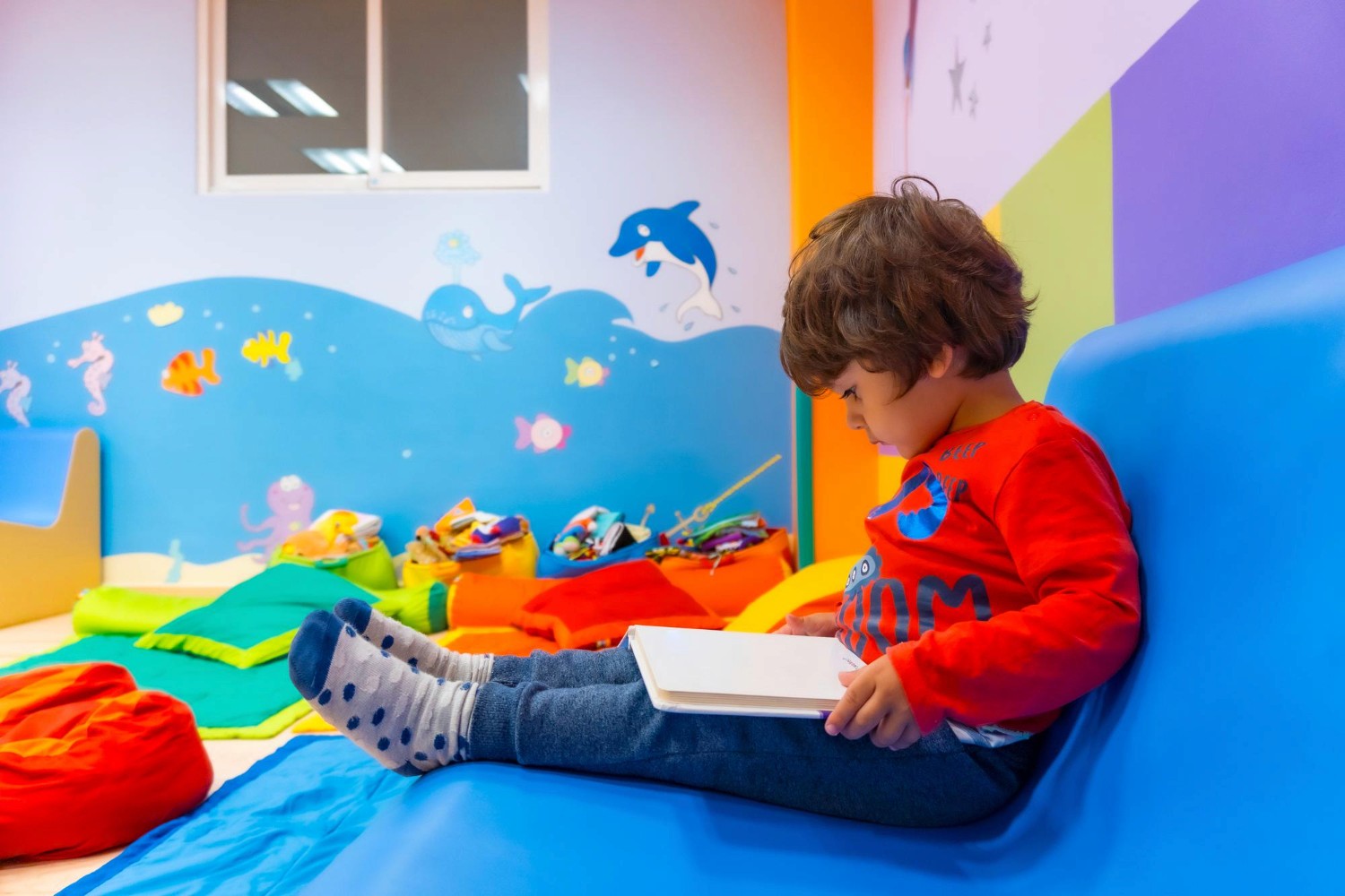 a black and white living room with a large tv