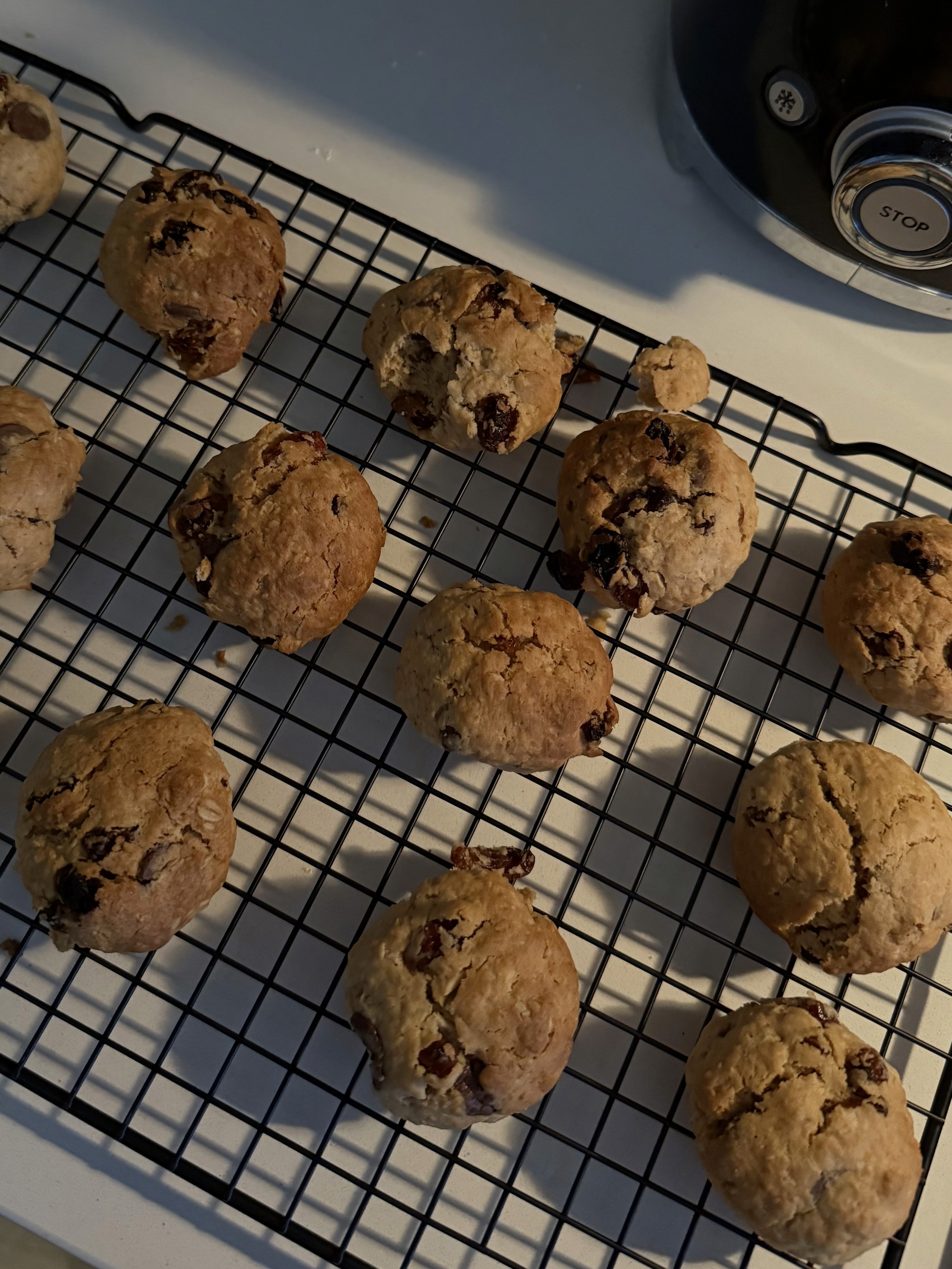 Golden oatmeal cookies cooling on a wire rack