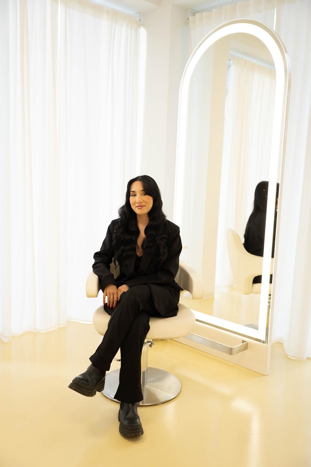 person sitting in a chair in front of a man