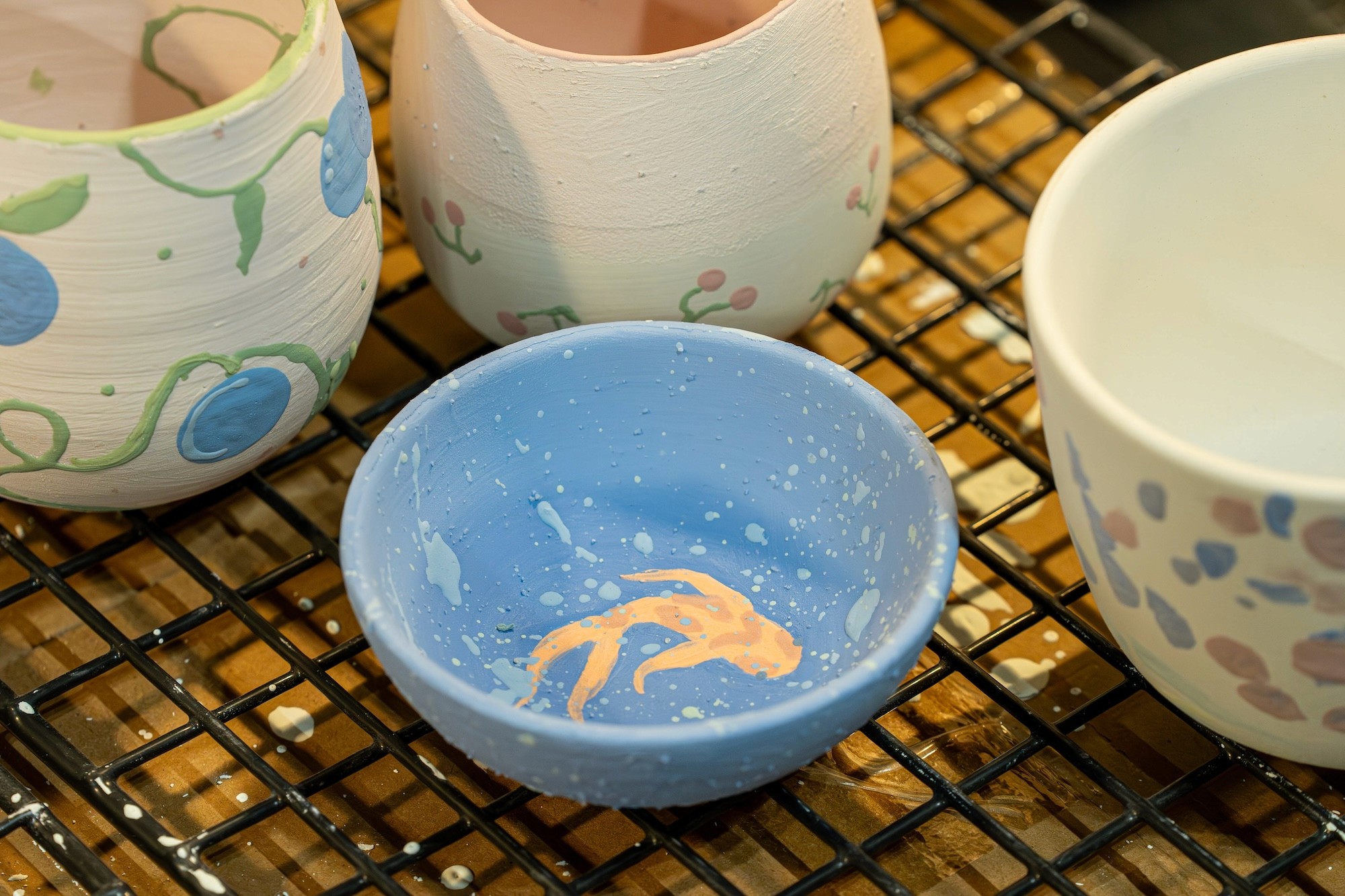 painted bisques ready to be glazed