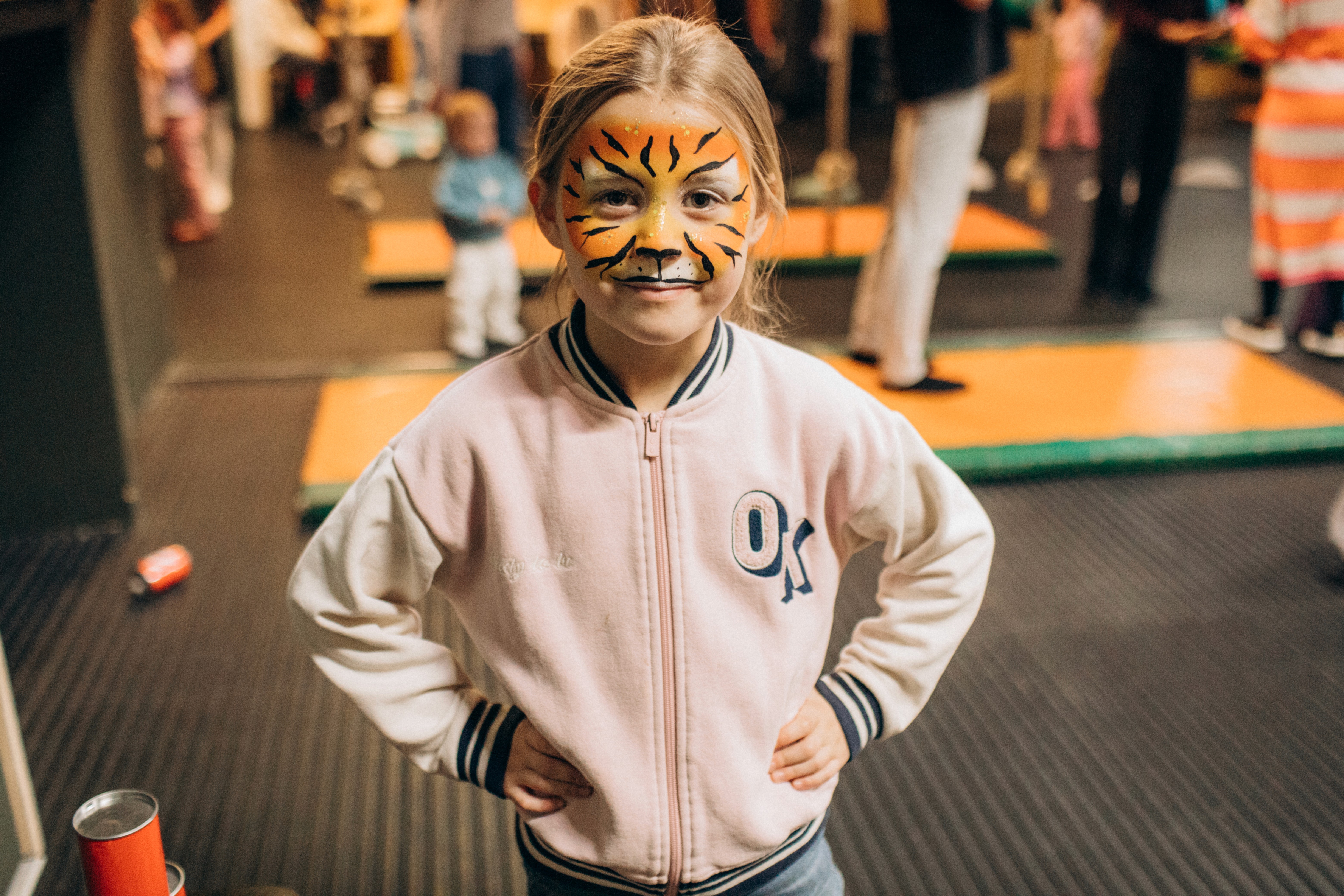 A man stading with Surfboard