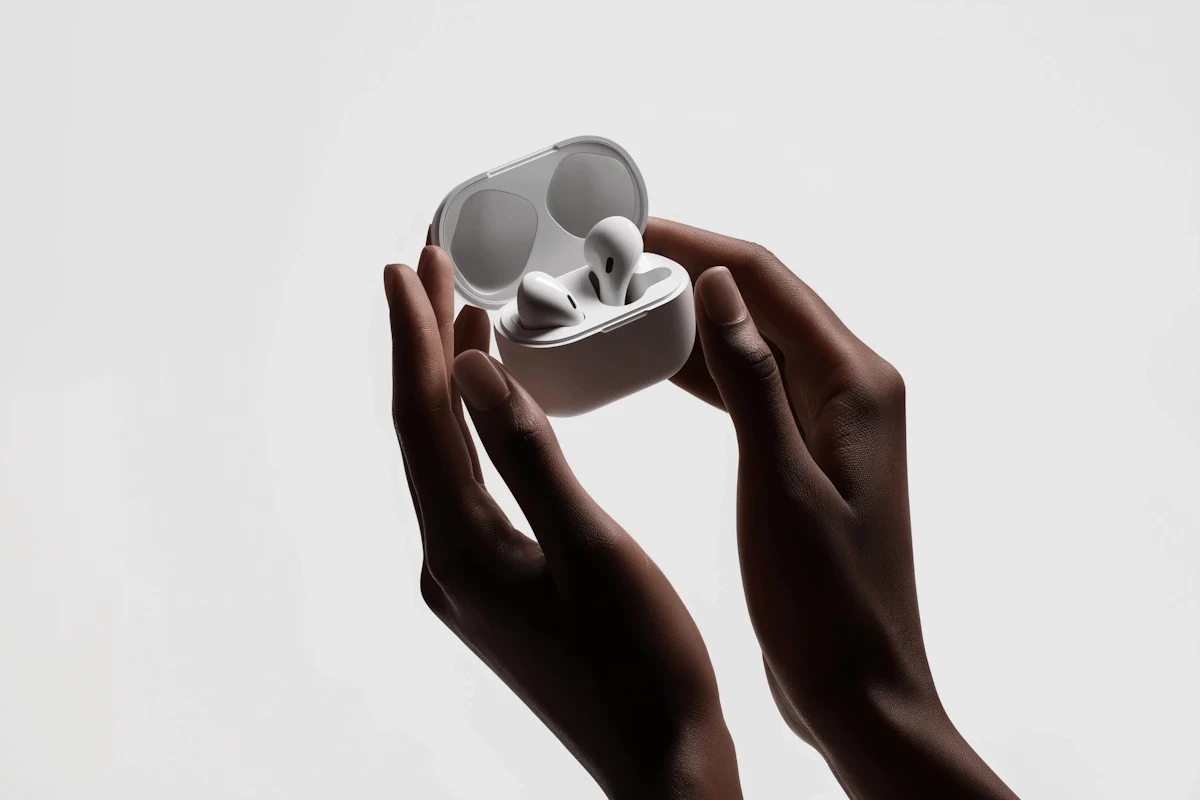 Airpods in hand