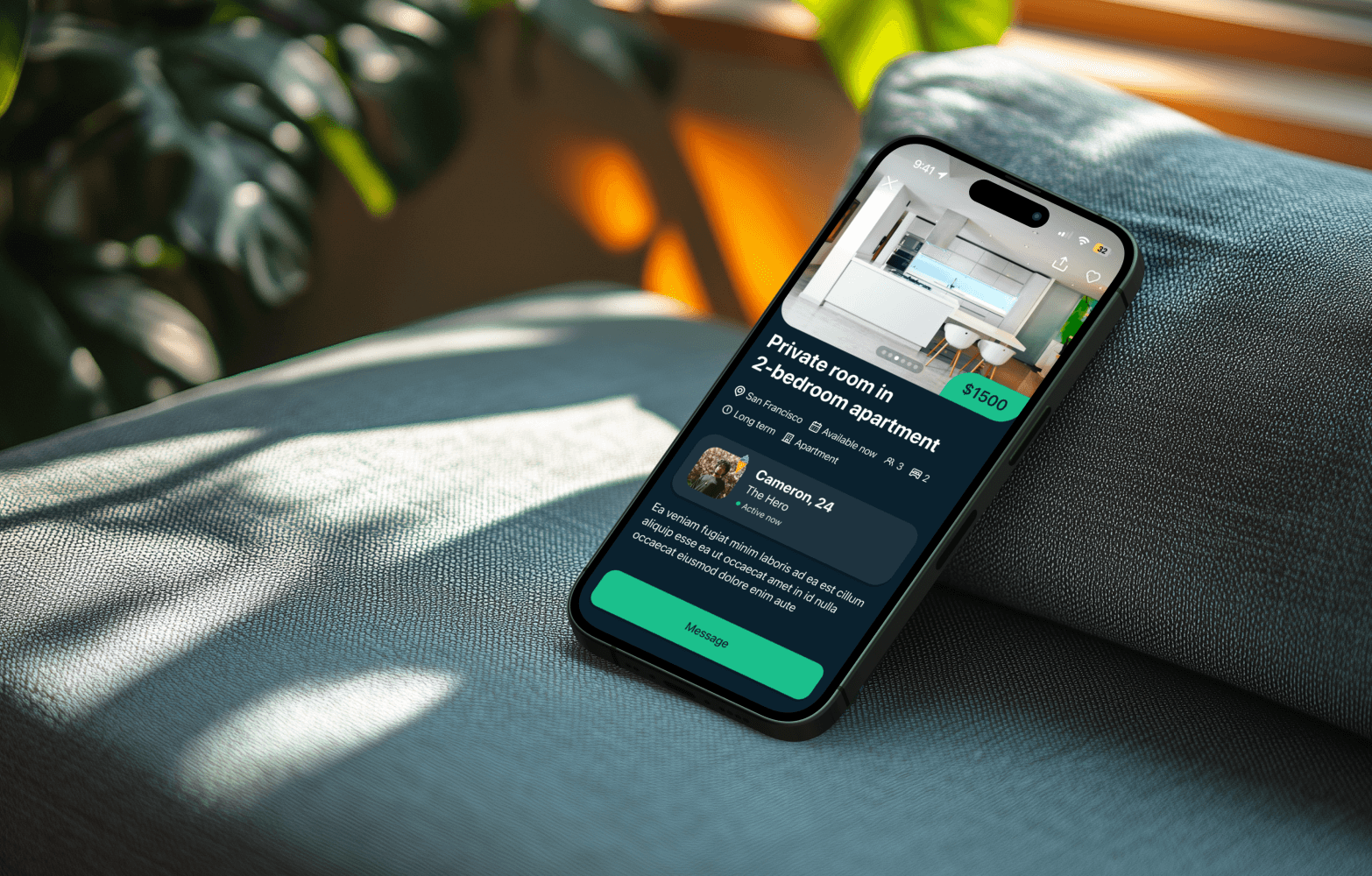 A smartphone on a fabric surface displays a room rental app listing a private room. Sunlight and plant shadows create a cozy ambiance.