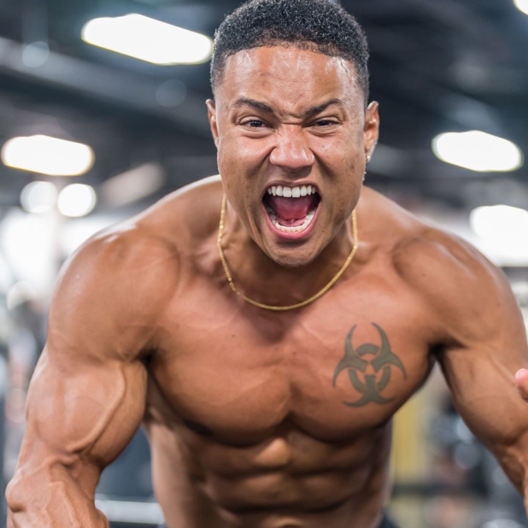 man wearing eyeglasses and blue shirt inside coffee shop