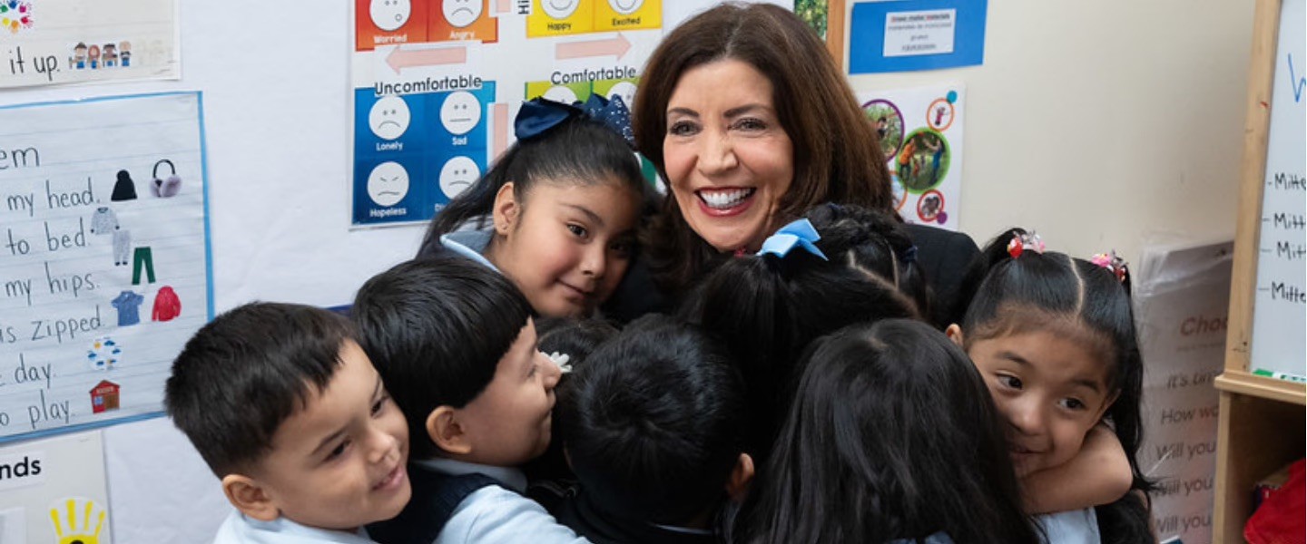 Governor Kathy Hochul hugging students