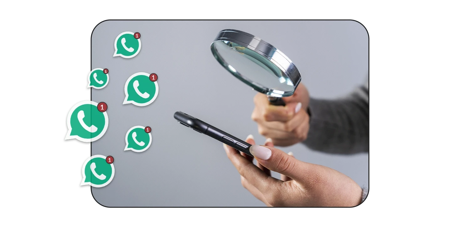 Empresário analisando o WhatsApp corporativo com uma lupa