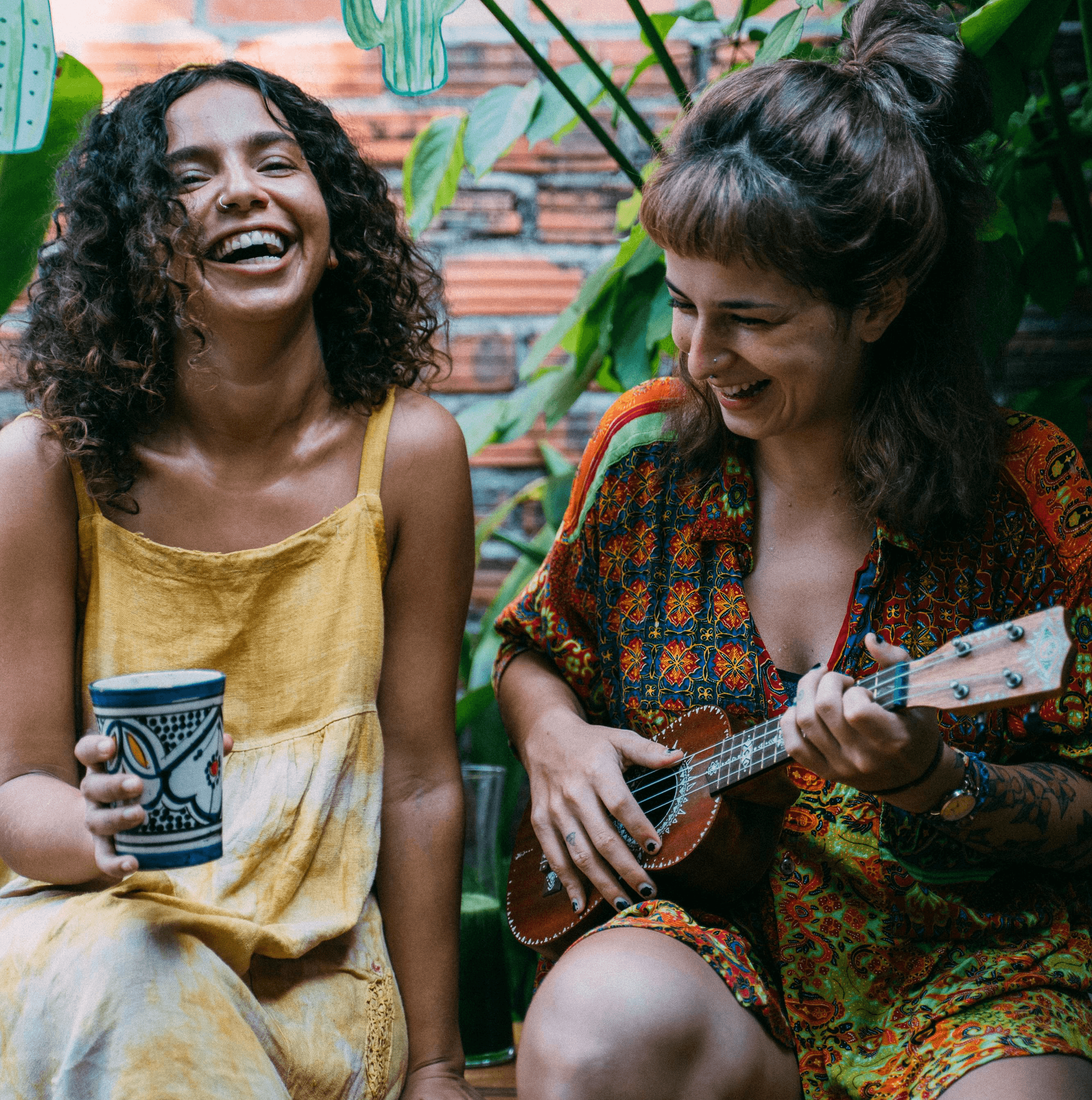 a man wearing glasses is looking at a laptop