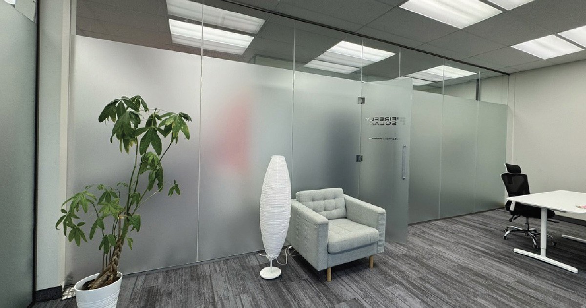 Office glass with frosted privacy film installed by DisplayWorks Signs & Graphics in Calgary.