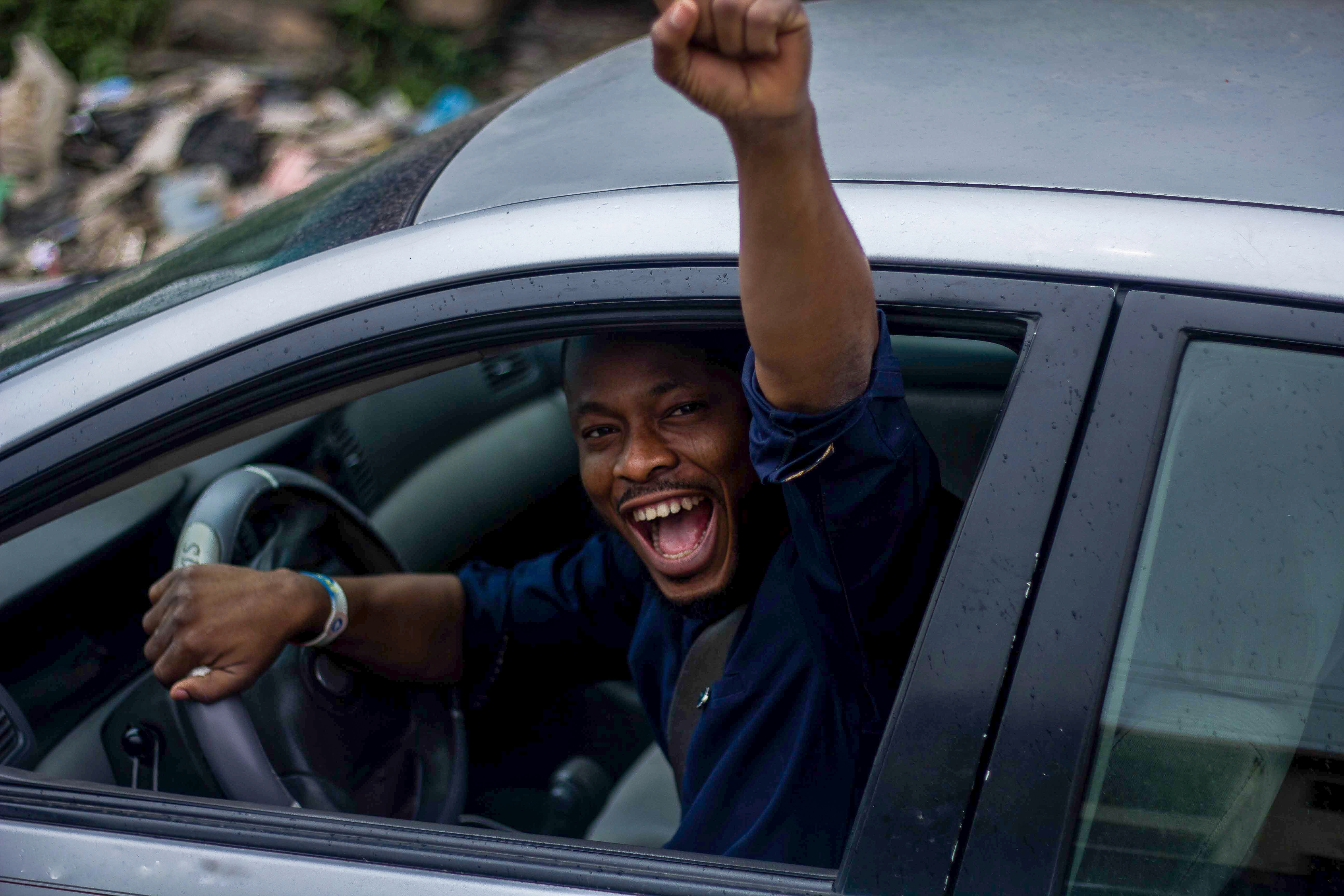 Woman smiling while driving a car