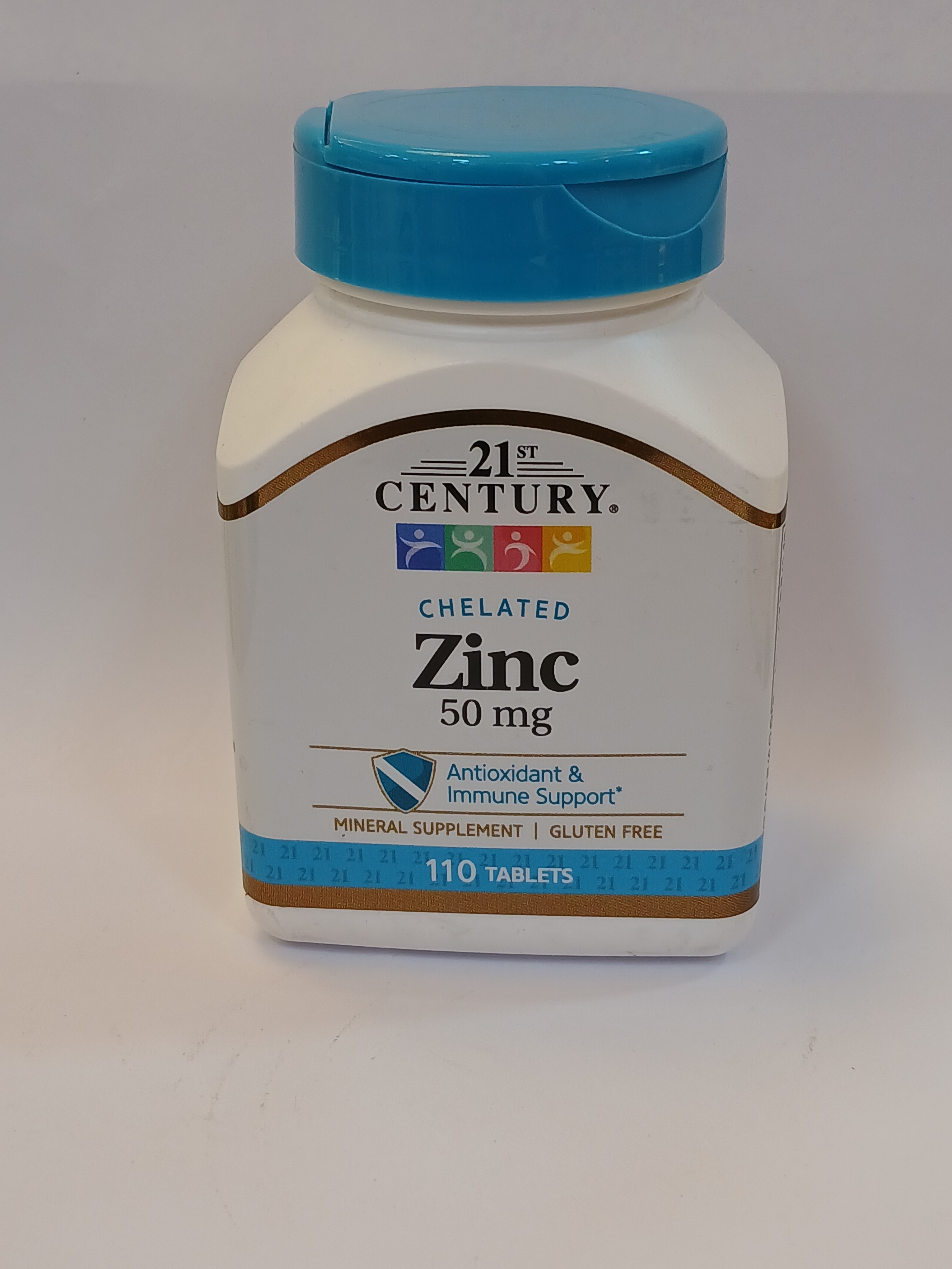 A white plastic bottle with a light blue flip-top cap contains "21st Century Chelated Zinc 50 mg" and "110 Tablets," featuring a gold border and a blue band at the bottom, all set against a plain white background.