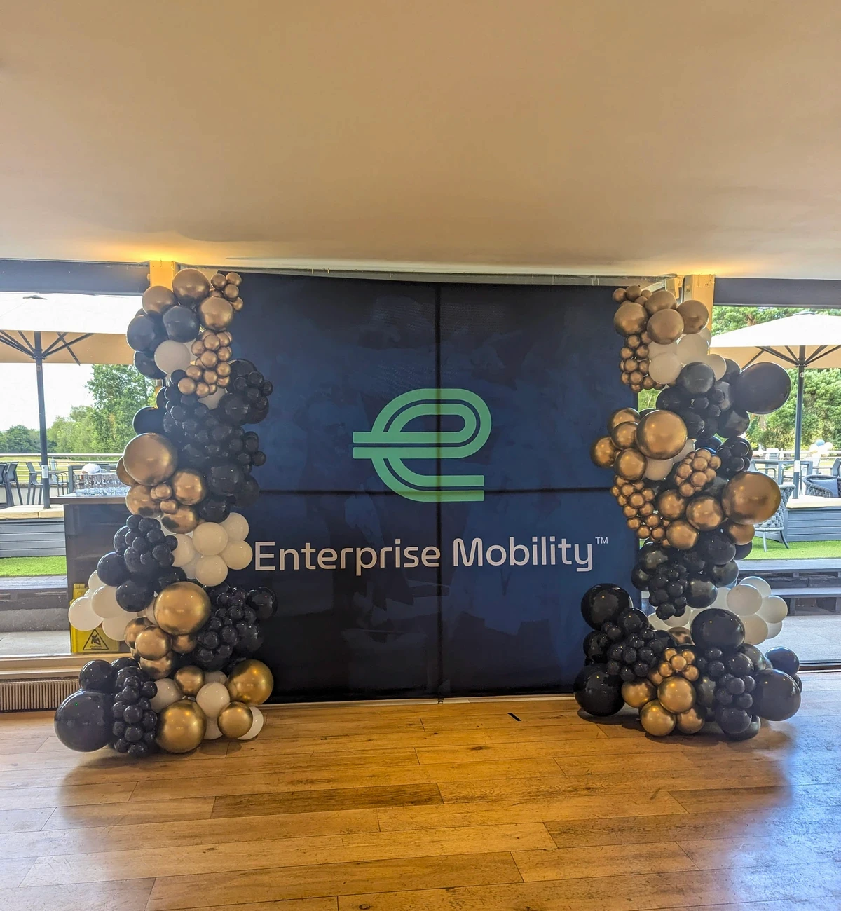 Elegant corporate balloon display for a brand launch event