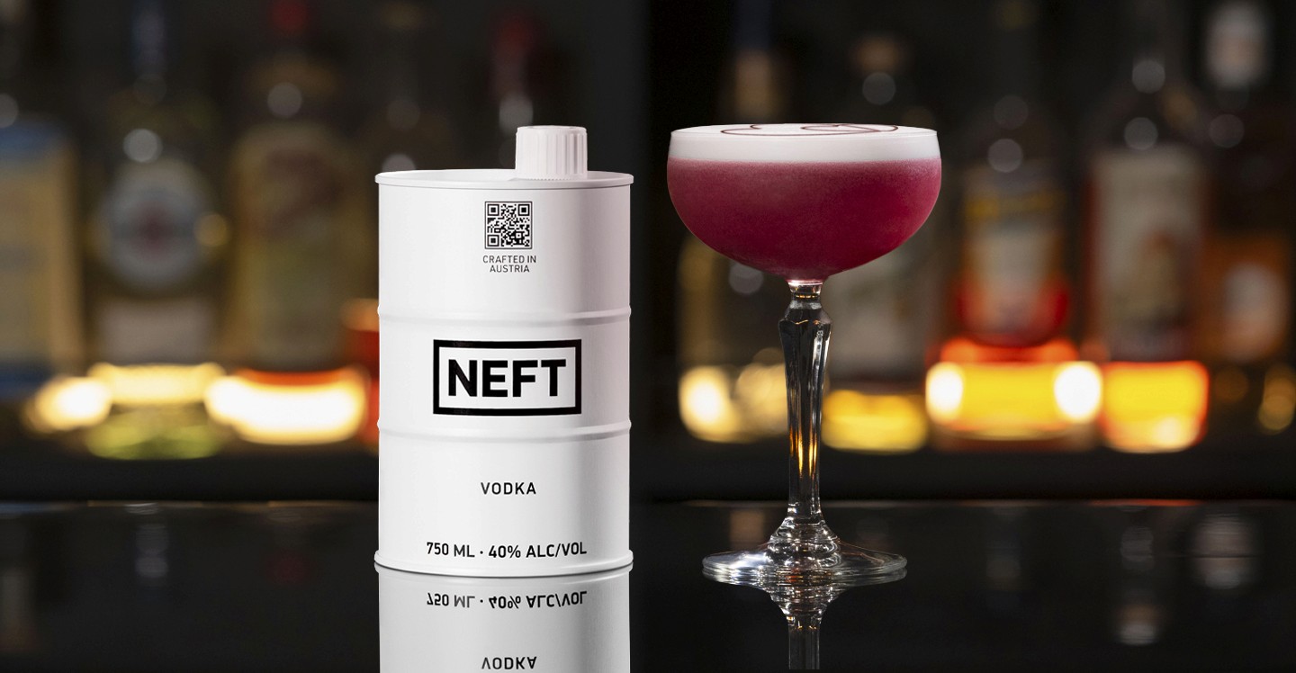 A NEFT Barrel and a glass of Two Hearts on a bar counter.