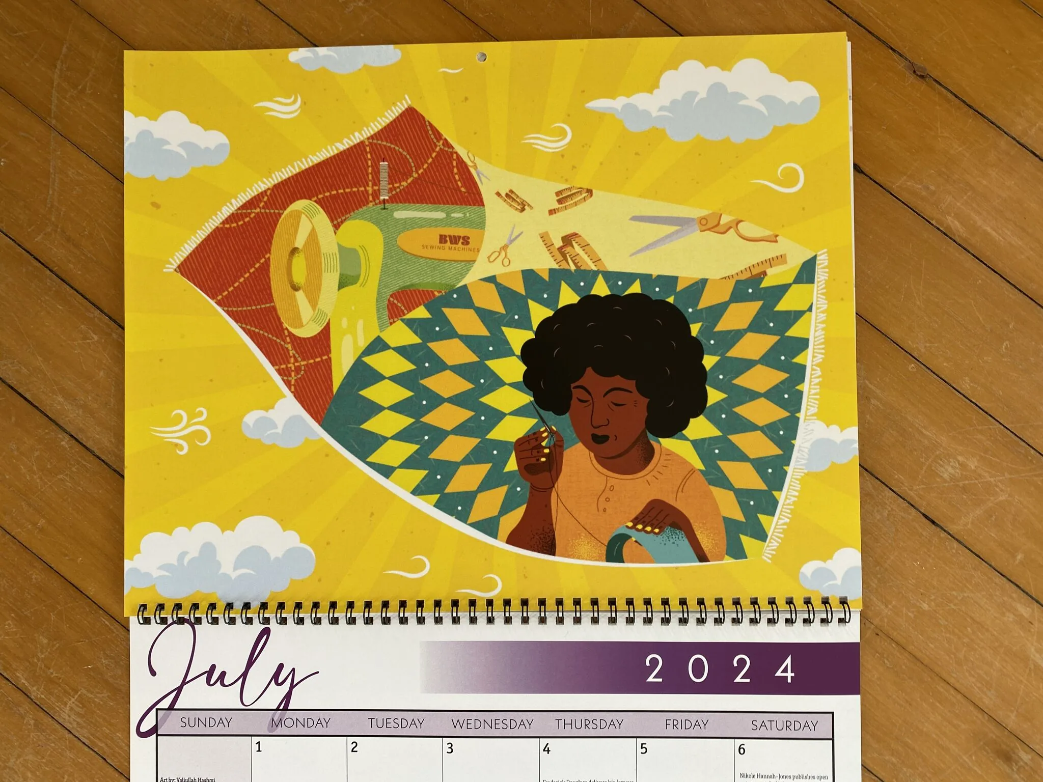 The Black Women Stitch illustration printed as the July 2024 page of a wall calendar