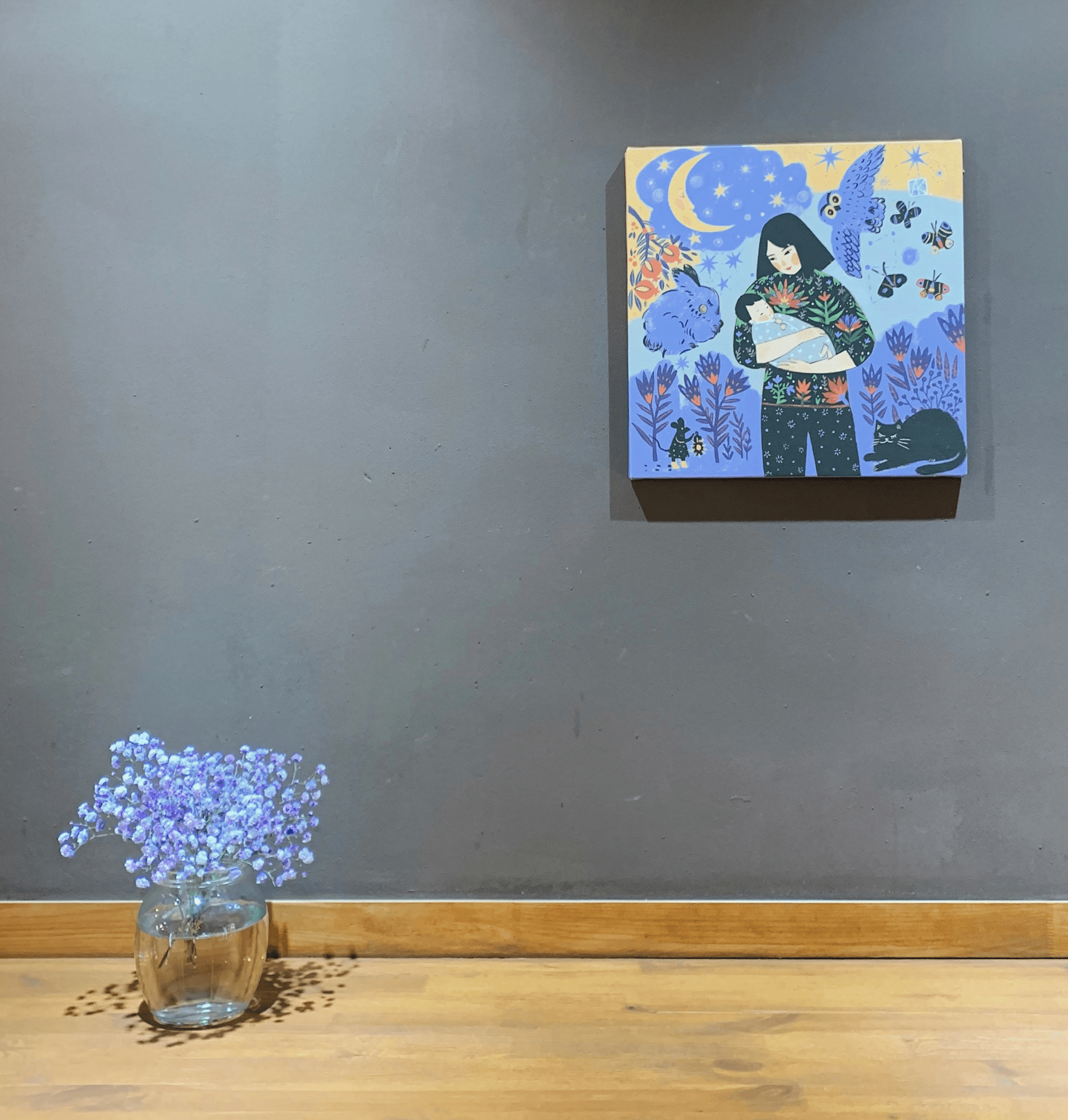 man carrying baby painting