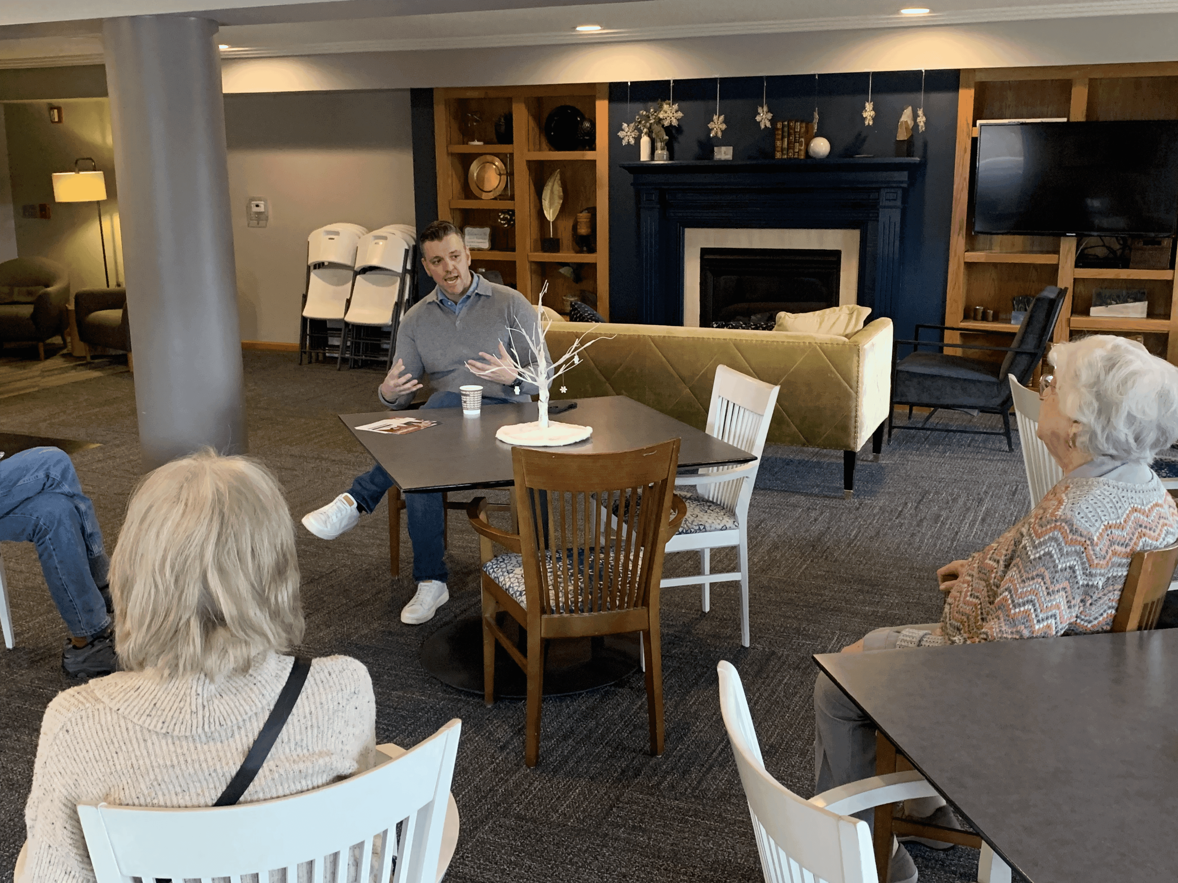 man drawing on dry-erase board