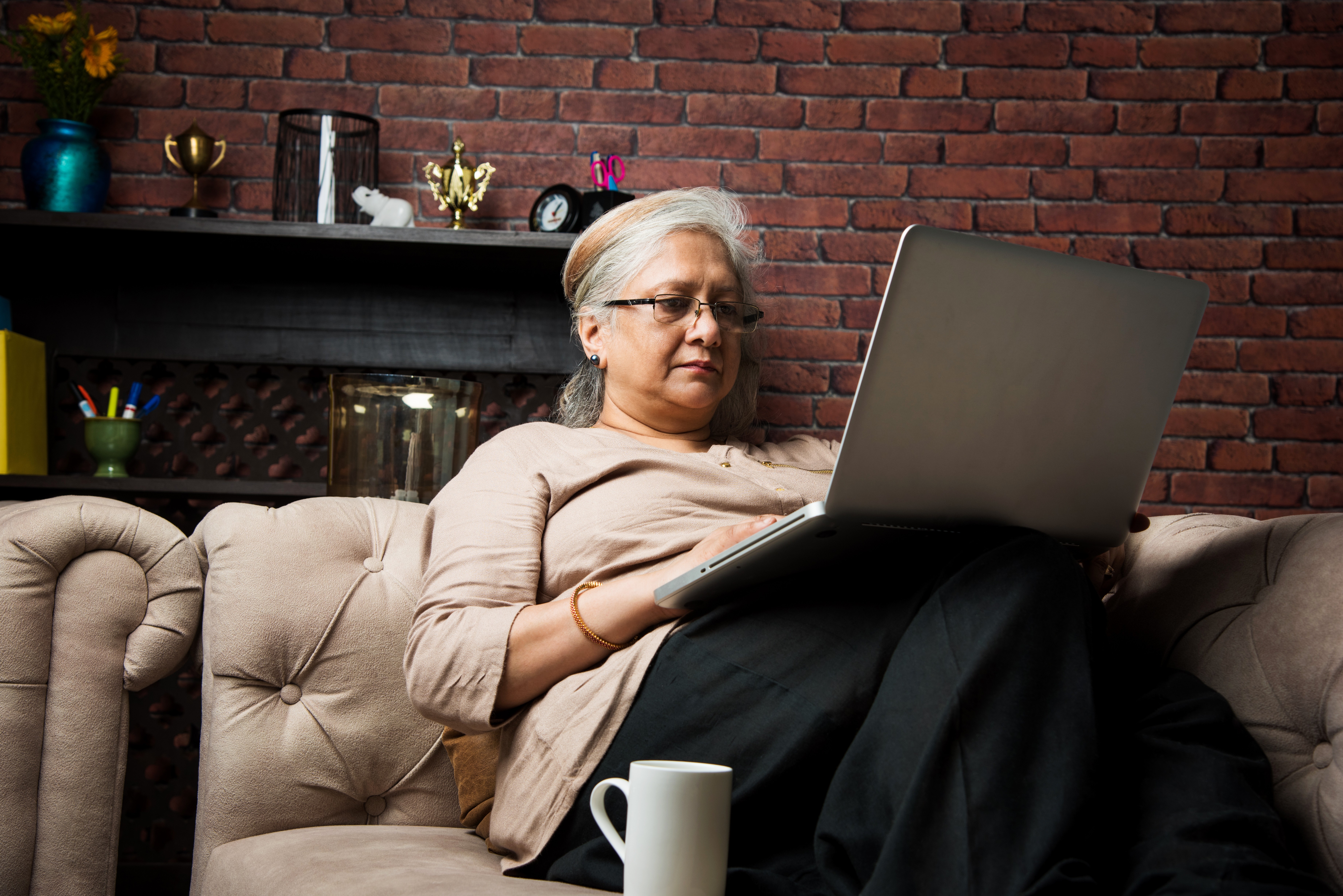 Woman Writing her sisters obituary