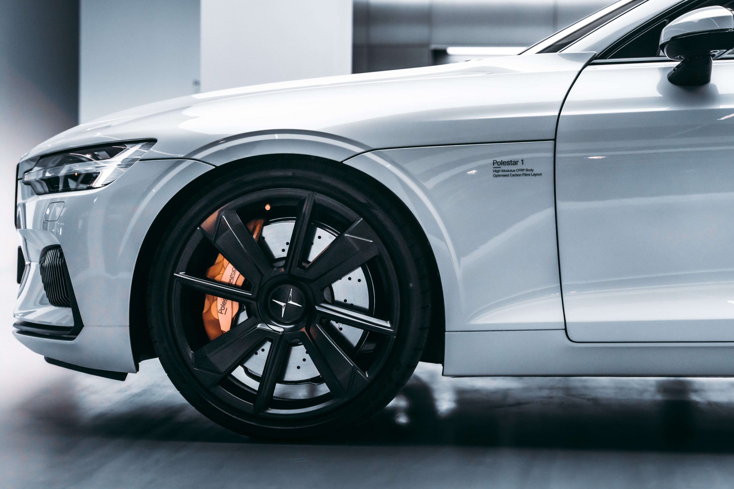 Close-up of a Polestar 1 electric performance car’s front wheel and side badge, representing Polestar as a publicly traded EV company.