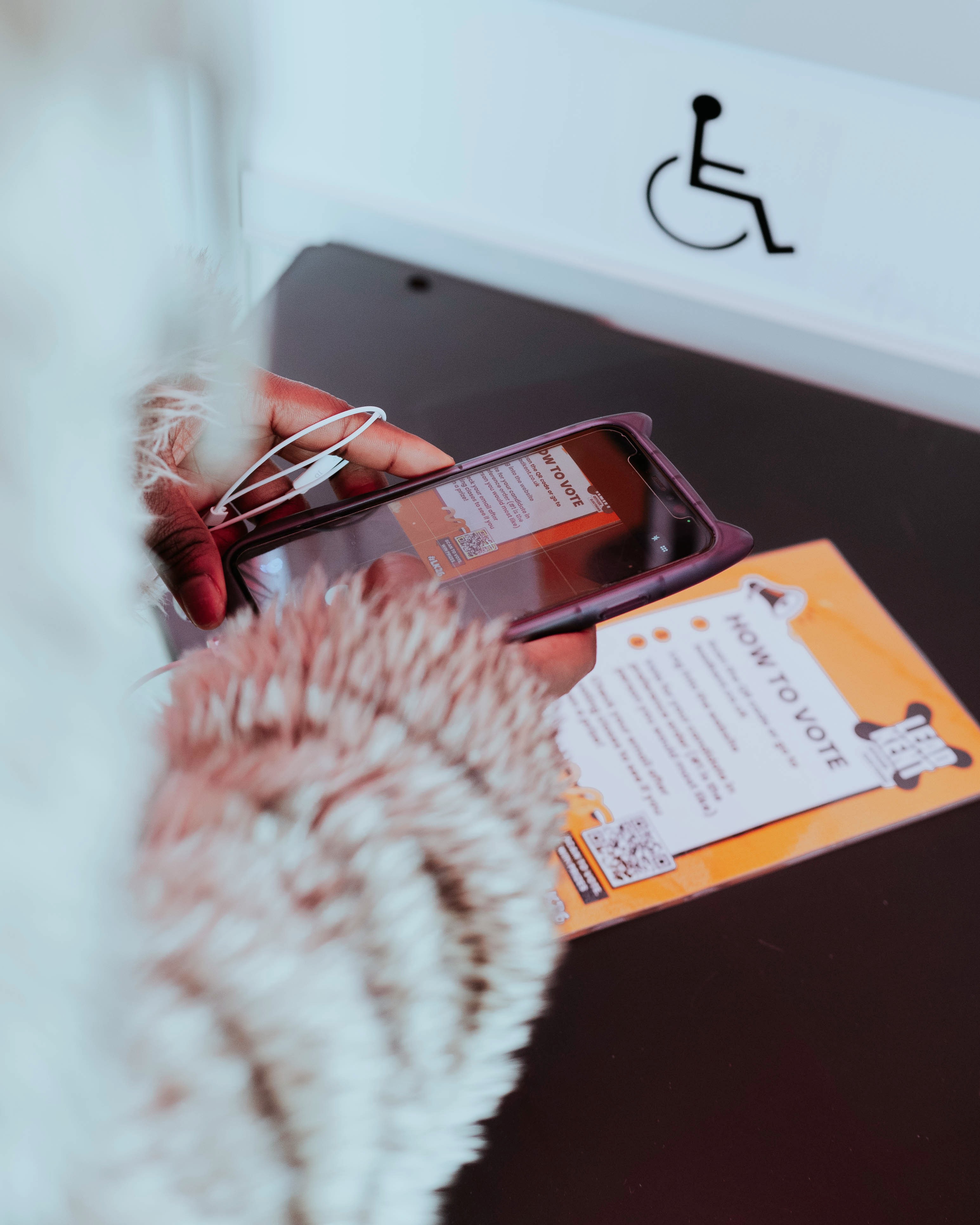 A person using a laptop which displays adverts for medical device products at various sizes.