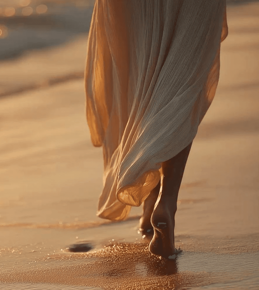 A circle of people sitting cross-legged, meditating with hands in a prayer position. Soft, warm lighting.