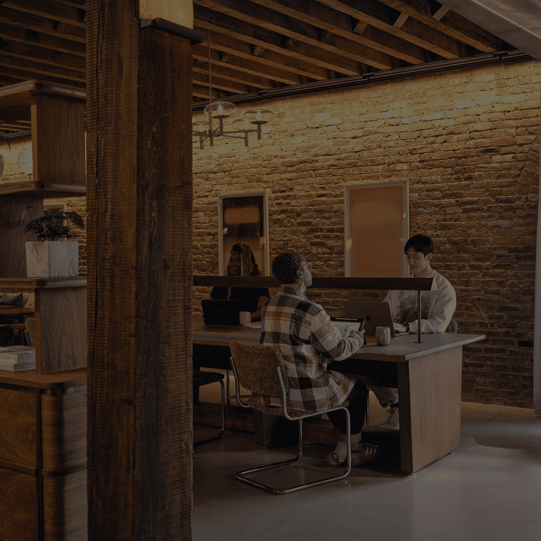 Blurry cityscape with red light and street lights at night.