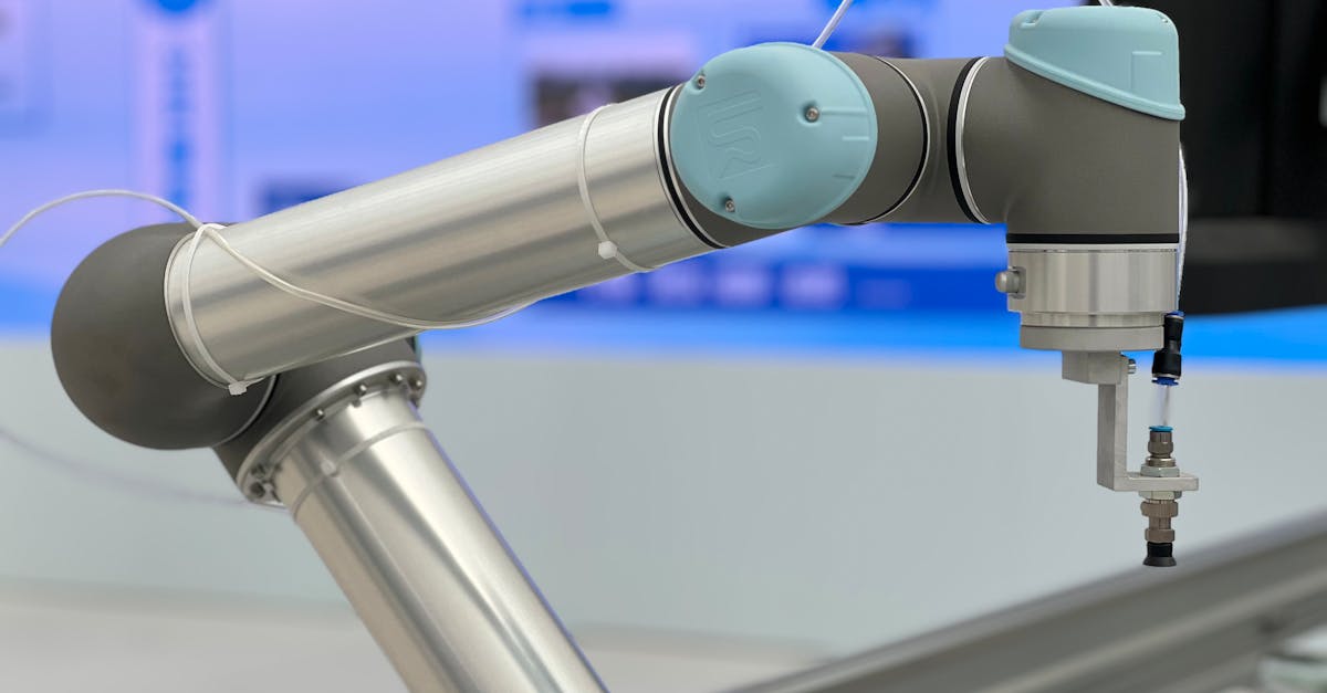 Detailed close-up of a modern industrial robotic arm in a manufacturing setting.